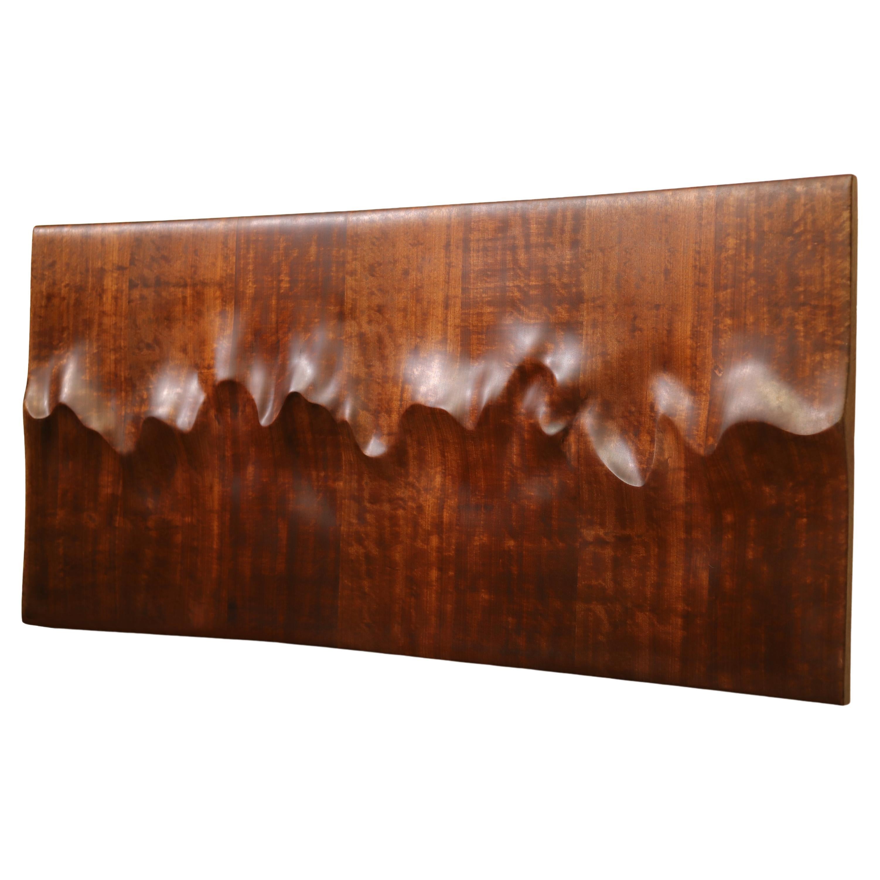 A timeless grand sculpture to place as a wall centerpiece. The artist studied and sketched the Sahara Desert and the Pacific Ocean for months to create the perfect silhouette that captures the essence of both. Its natural forms and organic wooden