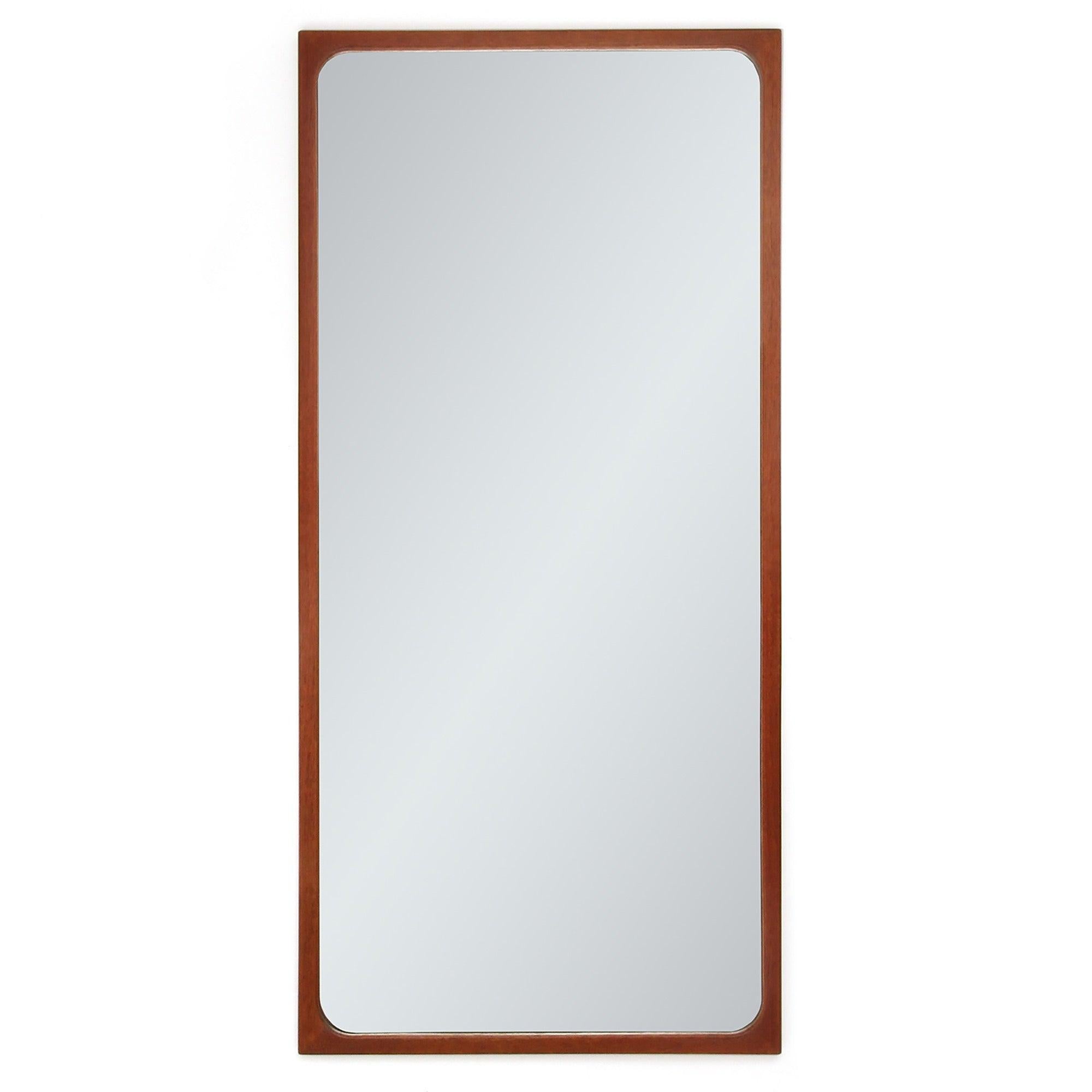 An elegant, finely detailed and beautifully crafted mirror and accompanying wall shelf with a drawer in warm teak. The drawer in the shelf has hand-cut dovetail joints and is accessed by an unusual tilt mechanism.