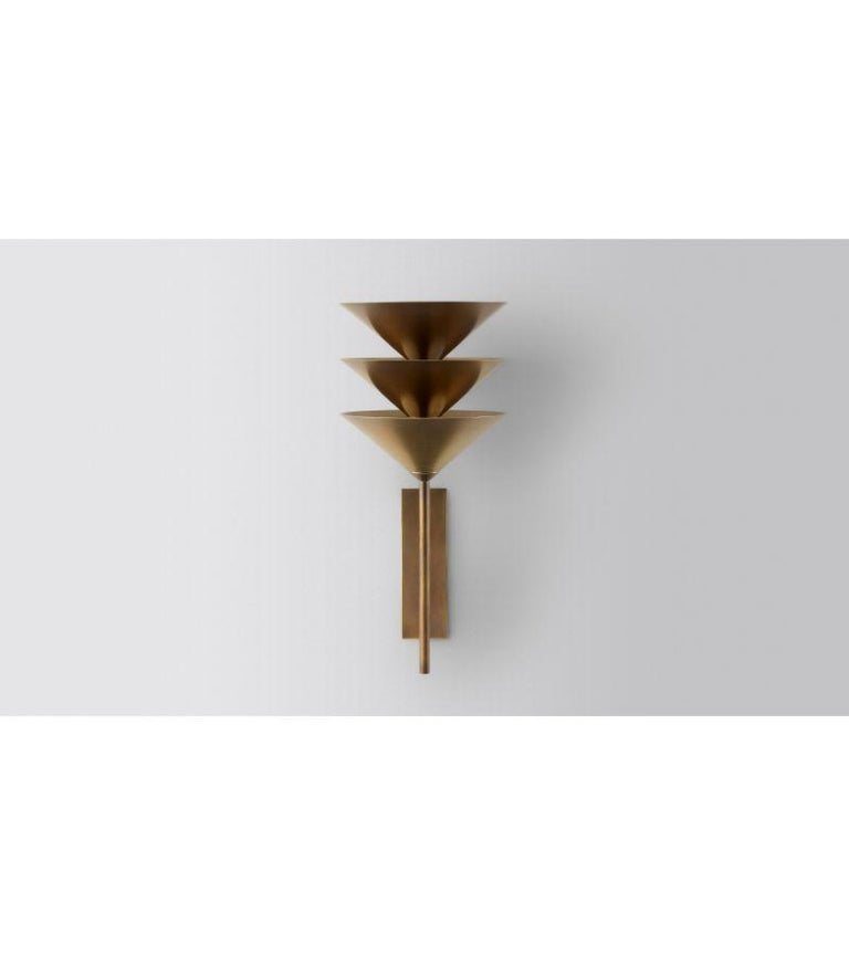 Wall Stack 3 by Volker Haug
Dimensions: D 24 x W 6 x H 46 cm 
Material: Brass. 
Finish: Polished, aged, brushed, bronzed, blackened, or plated
Light: G4 - 12V, LED x 9
Power supply: : 110V-240V, 12V transformer supplied
Weight: approx 3