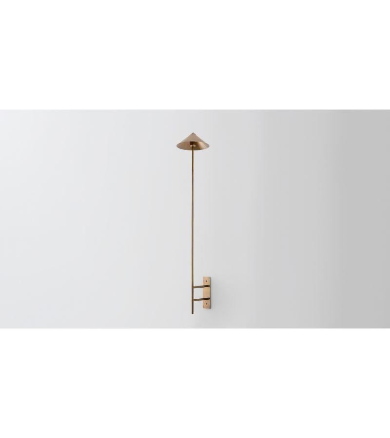 Wall stack down by Volker Haug
Dimensions: D 21 x W 6 x H 40 cm 
Material: Brass. 
Finish: Polished, Aged, Brushed, Bronzed, Blackened, or Plated
Light: 12V G4 LED x 3
Power supply: : 110V-240V, 12V transformer supplied
Weight: approx 2.5