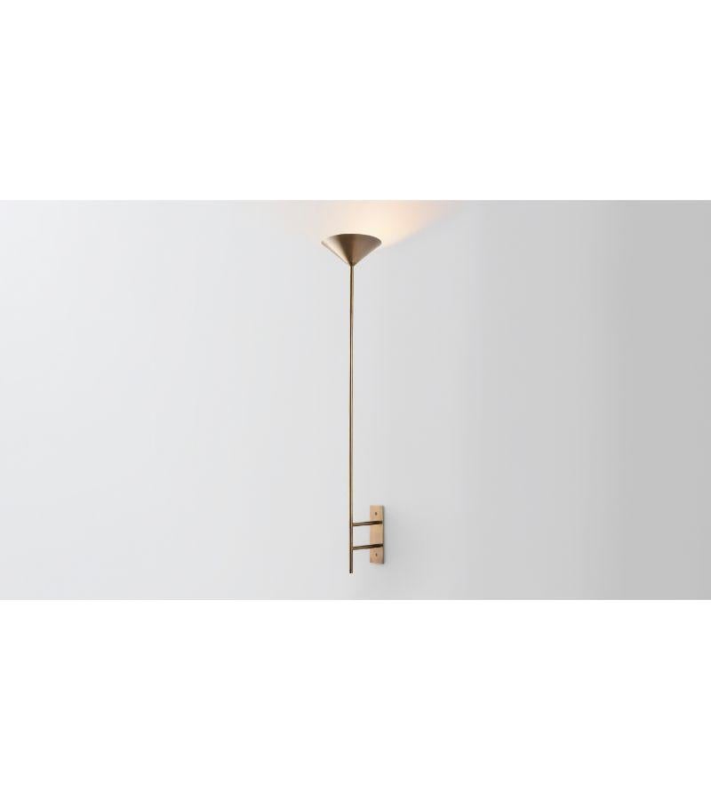 Wall stack up by Volker Haug
Dimensions: D 21 x W 6 x H 40 cm 
Material: Brass. 
Finish: Polished, aged, brushed, bronzed, blackened, or plated
Light: 12V G4 LED x 3
Power supply: : 110V-240V, 12V transformer supplied
Weight: approx 2.5