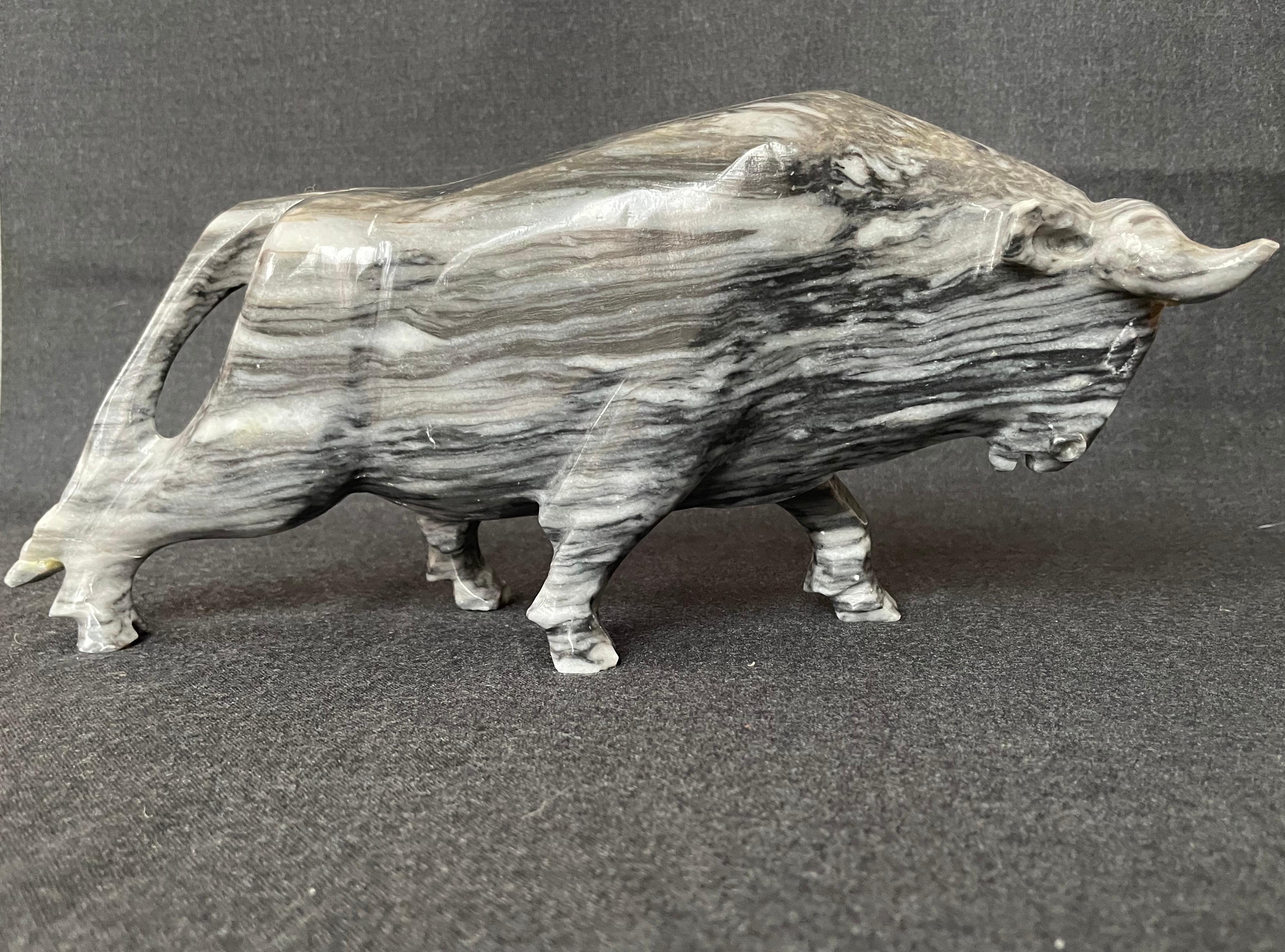 Wall Street bull sculpture. Italian grey bardiglio vintage sculpted raging bull. Carved from one solid piece of lustrously fluid grey marble, it’s natural striations used to advantage giving the bill a forward racing thrust. Perfect for the Wall