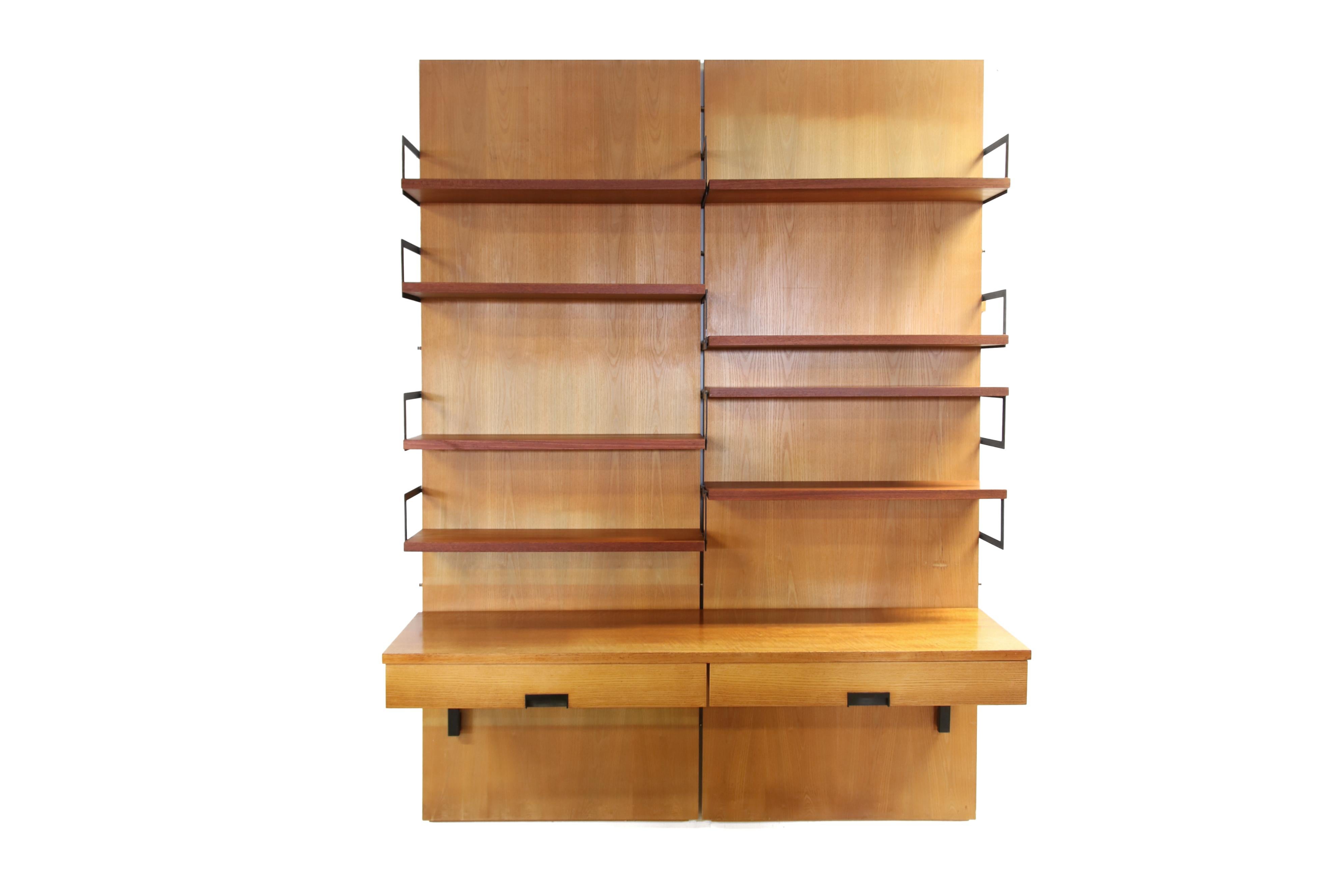 Rare wall system by Cees Braakman for Pastoe. This wall unit comes from the U + N series, the series better known as the Japanese series. This system consists of two ash veneered wall panels, 8 teak veneered shelves, 12 black lacquered metal