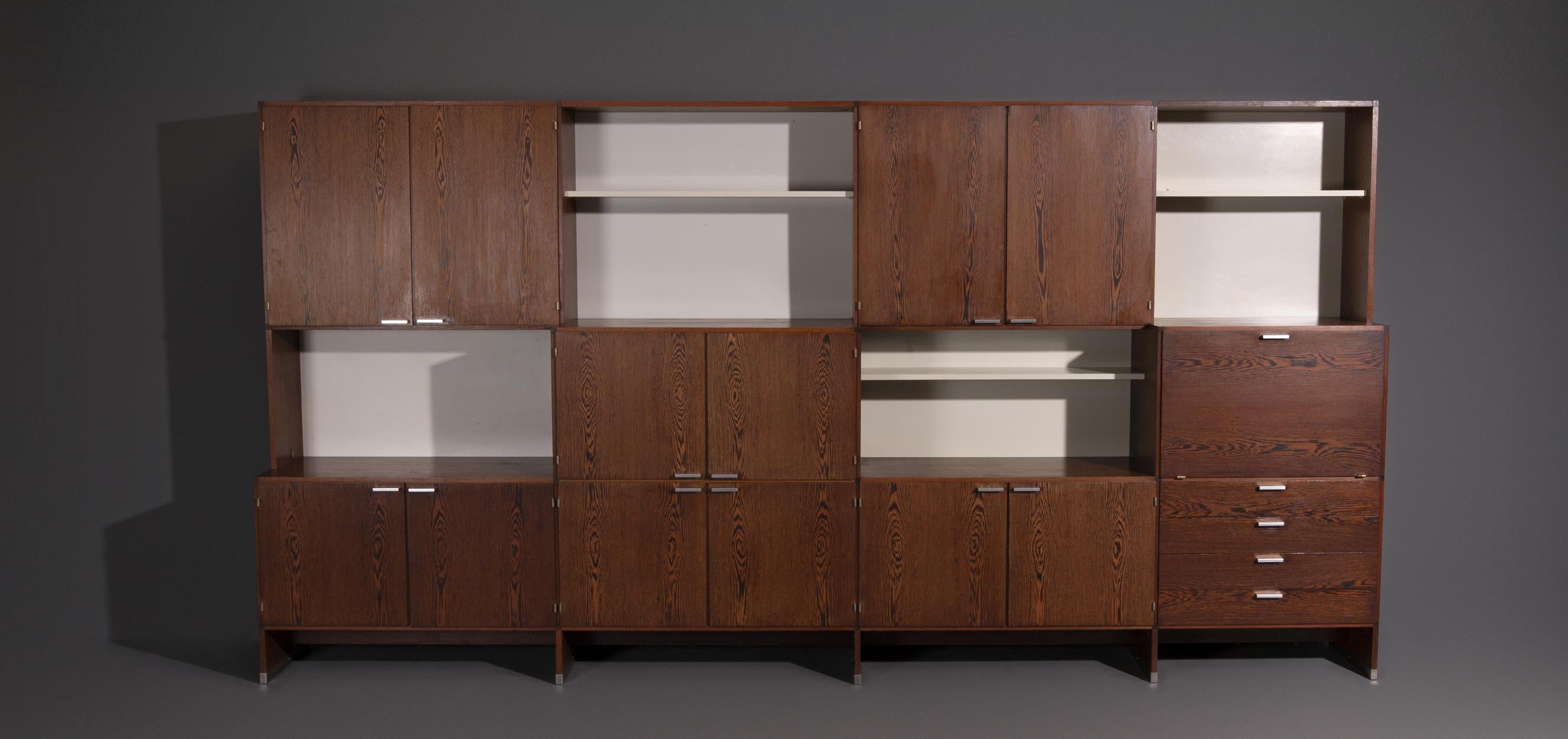 Cees Braakman wall system designed for Pastoe. Produced by Pastoe in the Netherlands, the 1950s. The cabinet is made of Wenge. Because of the cabinets and shelves, the wall system has enough storage space but also enough room to exhibit your special