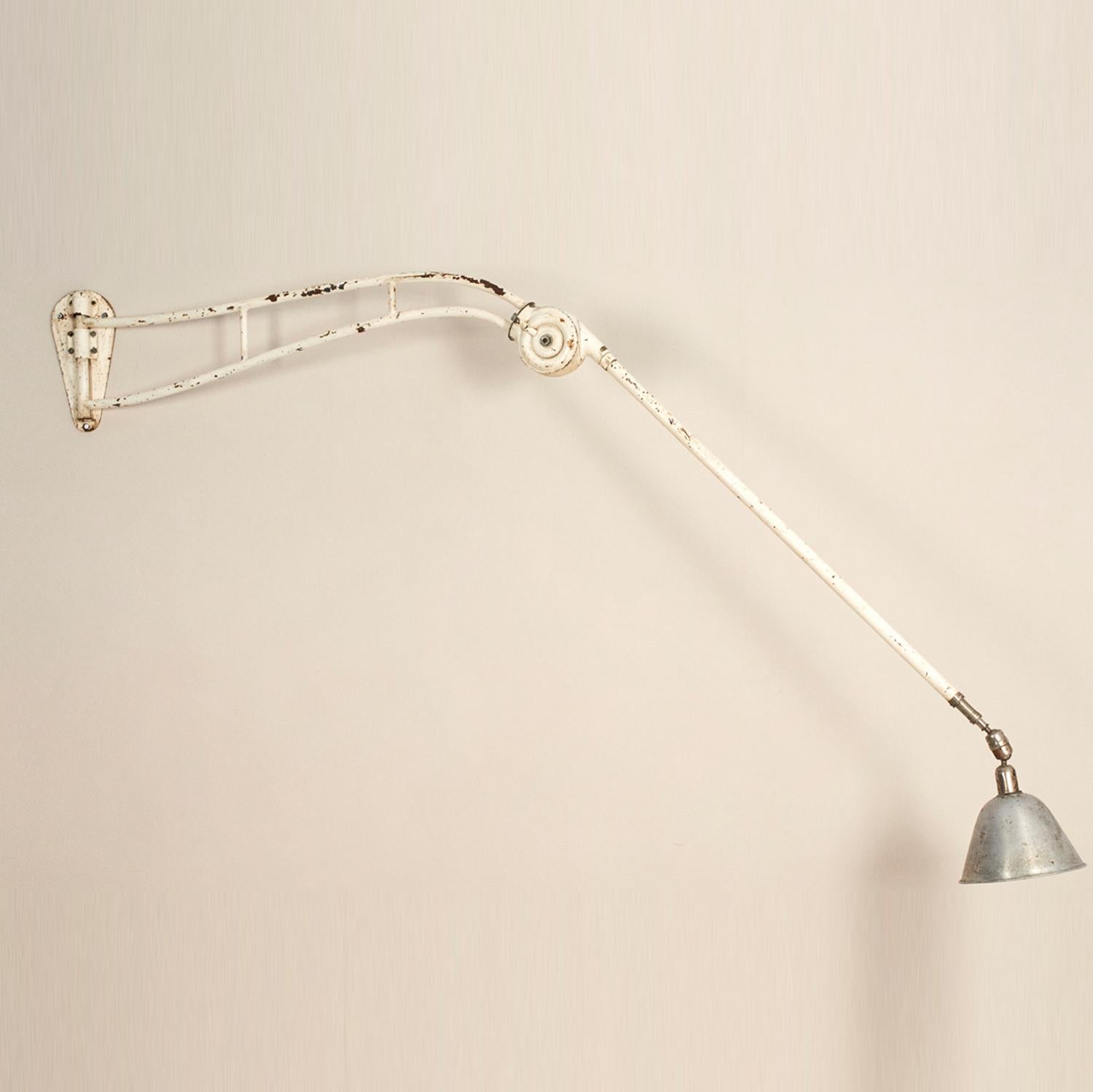 Monumental wall lamp designed by Johan Petter Johansson for Triplex, Sweden, fully adjustable and telescopic arm. White lacquered and chrome, nice original condition, marked and stamped, the central joint is still enough strong to support the arm in