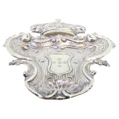 Wall tray in cut silver with embossed coat of arms