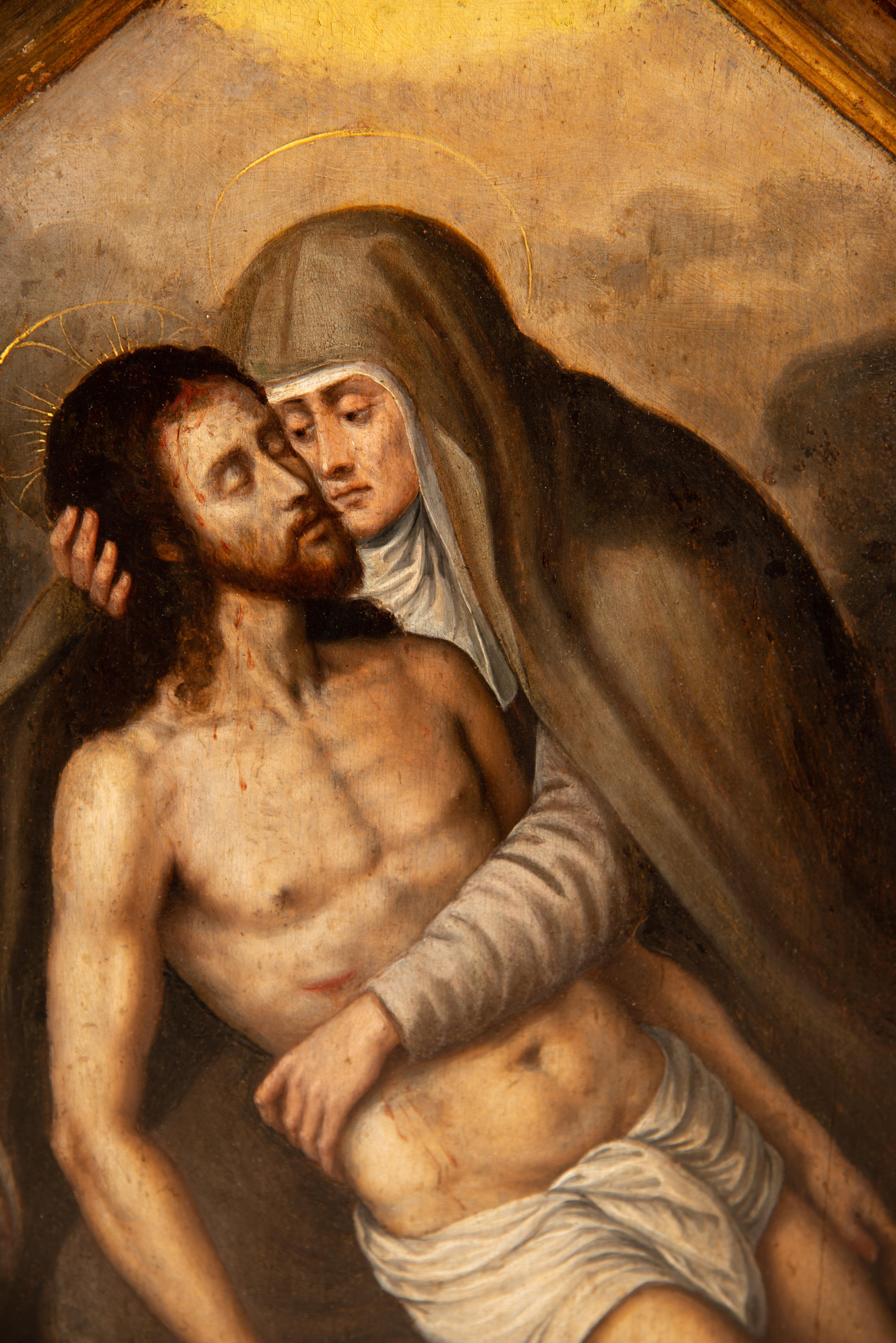 Wall triptych, Pietà and Saints John. Oil on panel, metal. Spanish school, 16th 3