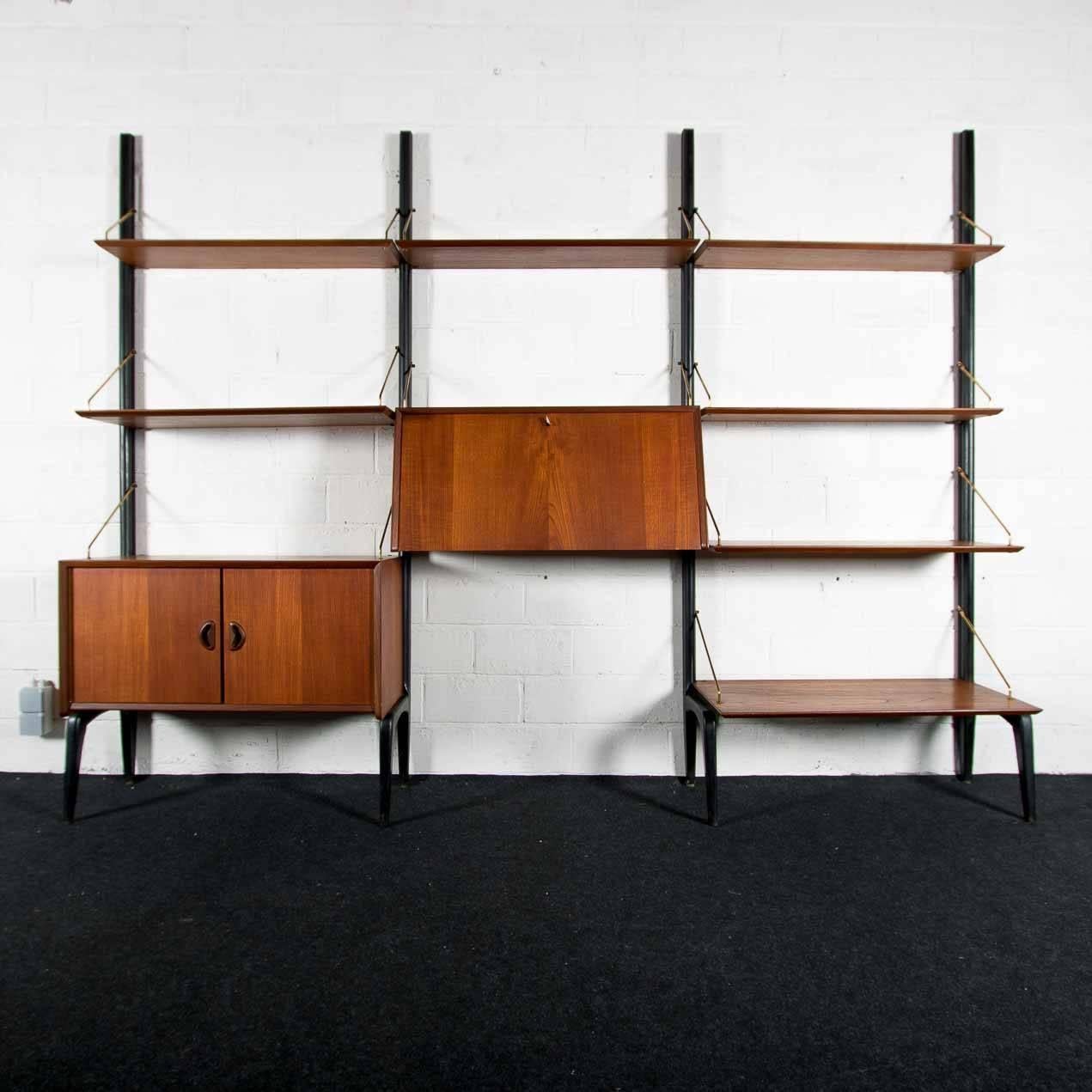 Wall unit by Dutch designer Louis Van Teeffelen for Wébé.
Has four pillars in black lacquered wood.
The shelves, desk and cabinet are modular and can be adjust to your own wishes.