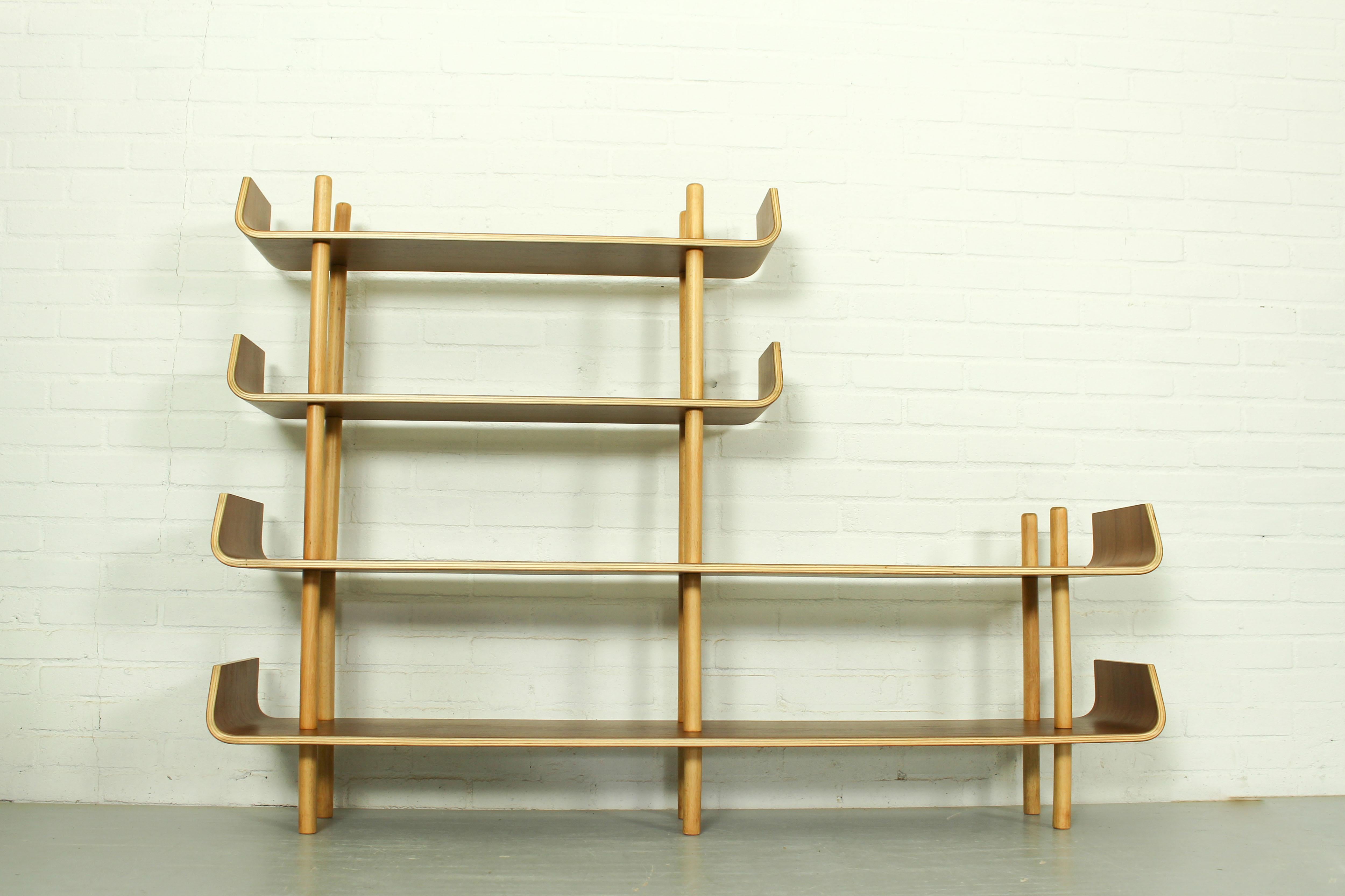 Bookshelf Model 545 by Willem Lutjens for Gouda den Boer, 1953. Made of teak plywood, timeless and organic design! The bentwood ends are typical for these bookshelves, they are connected by poles. The cabinet can be used as room divider or as wall