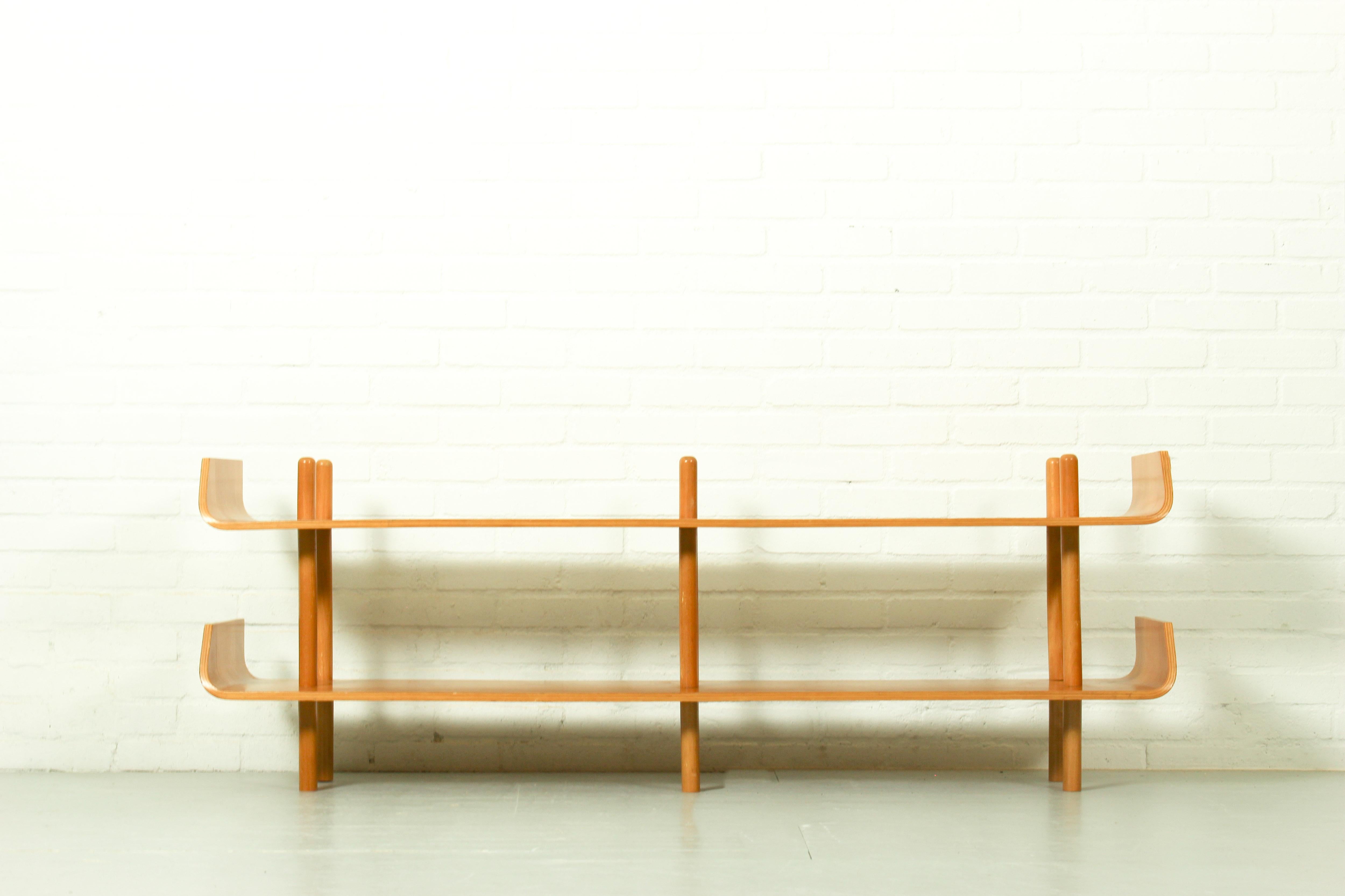 Bookshelf Model 545 by Willem Lutjens for Gouda den Boer, 1953. Made of beech plywood, timeless and organic design! The bentwood ends are typical for these bookshelves, they are connected by poles. It is in good condition.

Dimensions: 53cm h, 150cm