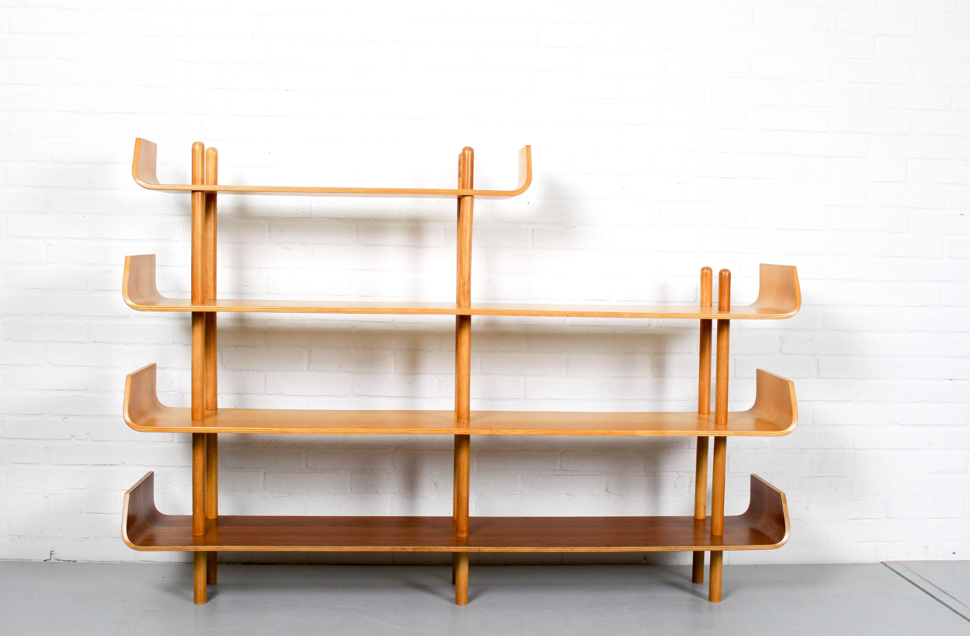 Bookshelf Model 545 by Willem Lutjens for Gouda den Boer, 1953. Made of beech plywood and teak plywood, timeless and organic design! The bentwood ends are typical for these bookshelves, they are connected by poles. The cabinet can be used as room