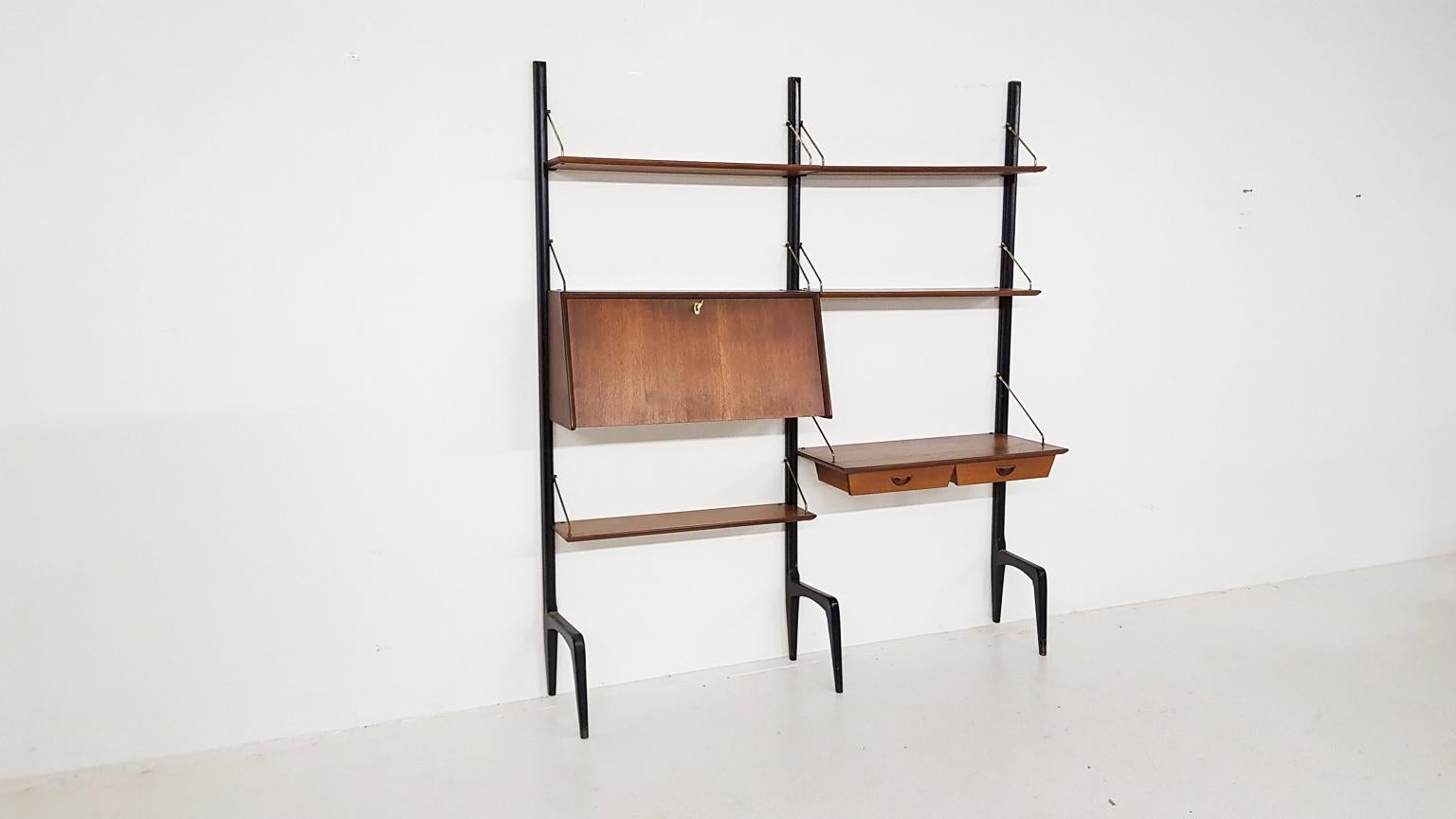 Shelving system, wall unit or bookcase designed by Dutch furniture designer Louis Van Teeffelen for Wébé the Netherlands in the 1950s.

This wall unit or shelving system has to be one of the finest storage designs from the Dutch, midcentury. In