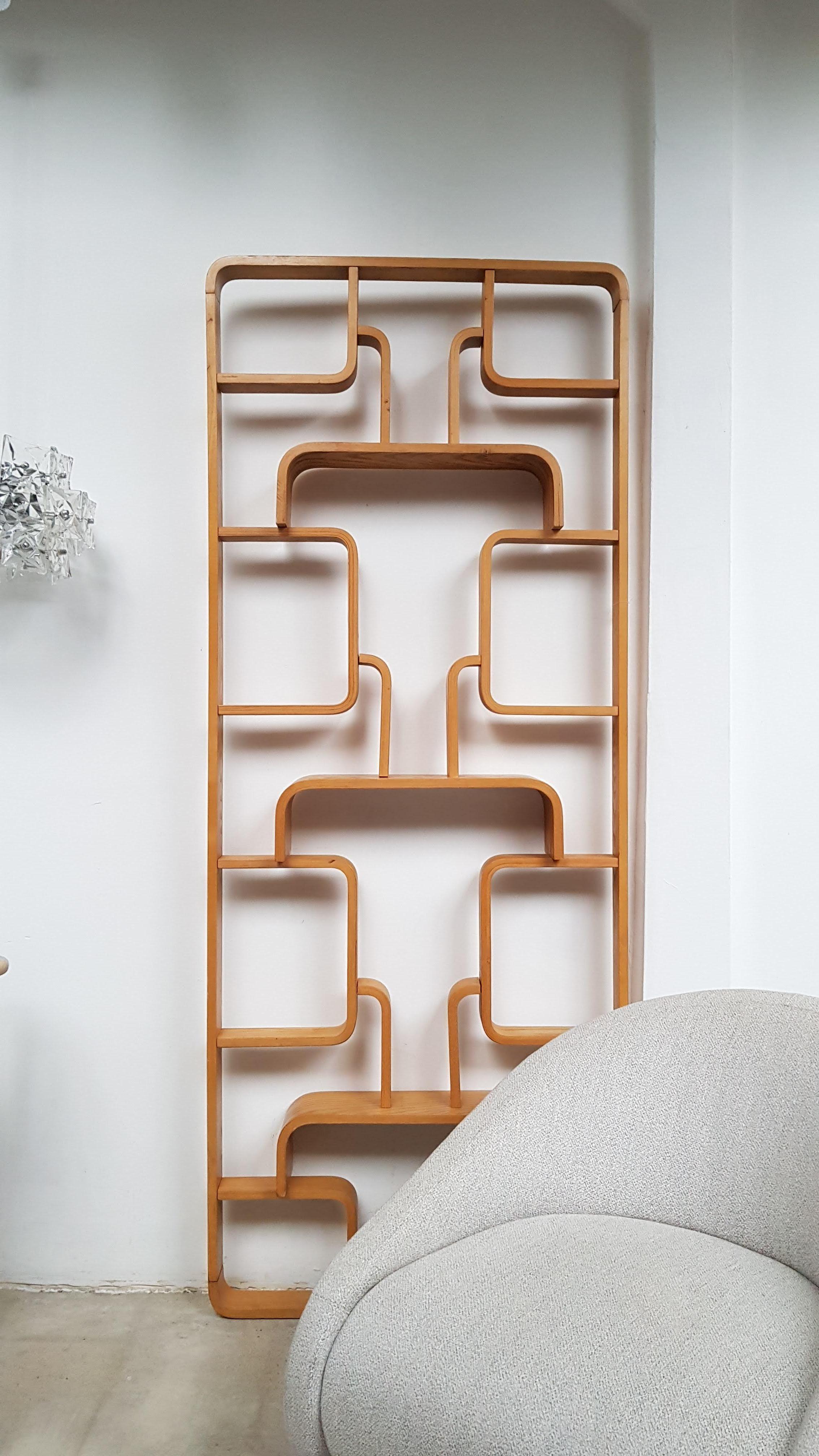 Dividing wall made of the bent beech plywood and features geometric patterns. This is the seldom version with the round corners. 
Designed by Ludvik Volak and manufactured in Czekoslovakia in Drevnopodnik Holesov in the 1960s. Measurements: H 225 x