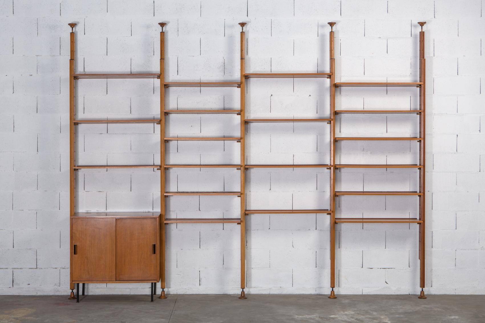 A stunning, rare and substantial bookcase/wall unit – including the original cabinet section – designed by Leonardo Fiori for I.S.A. Bergamo in the 1950s. Comprises 19 shelves and 5 adjustable upright sections. With makers mark and in wonderful