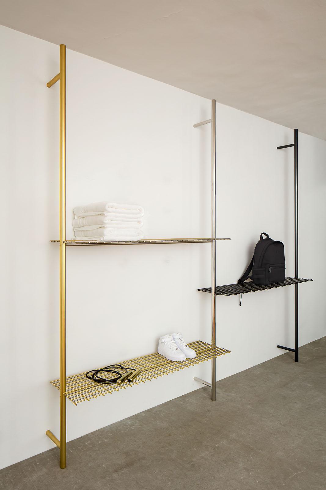 This triple post wall-mounting shelving unit is a mixture of metal finishes and colors. The grid-like shelves with its sleek lines bring an element of airiness and open spaces. 

This item requires two professional contractors for assemble and