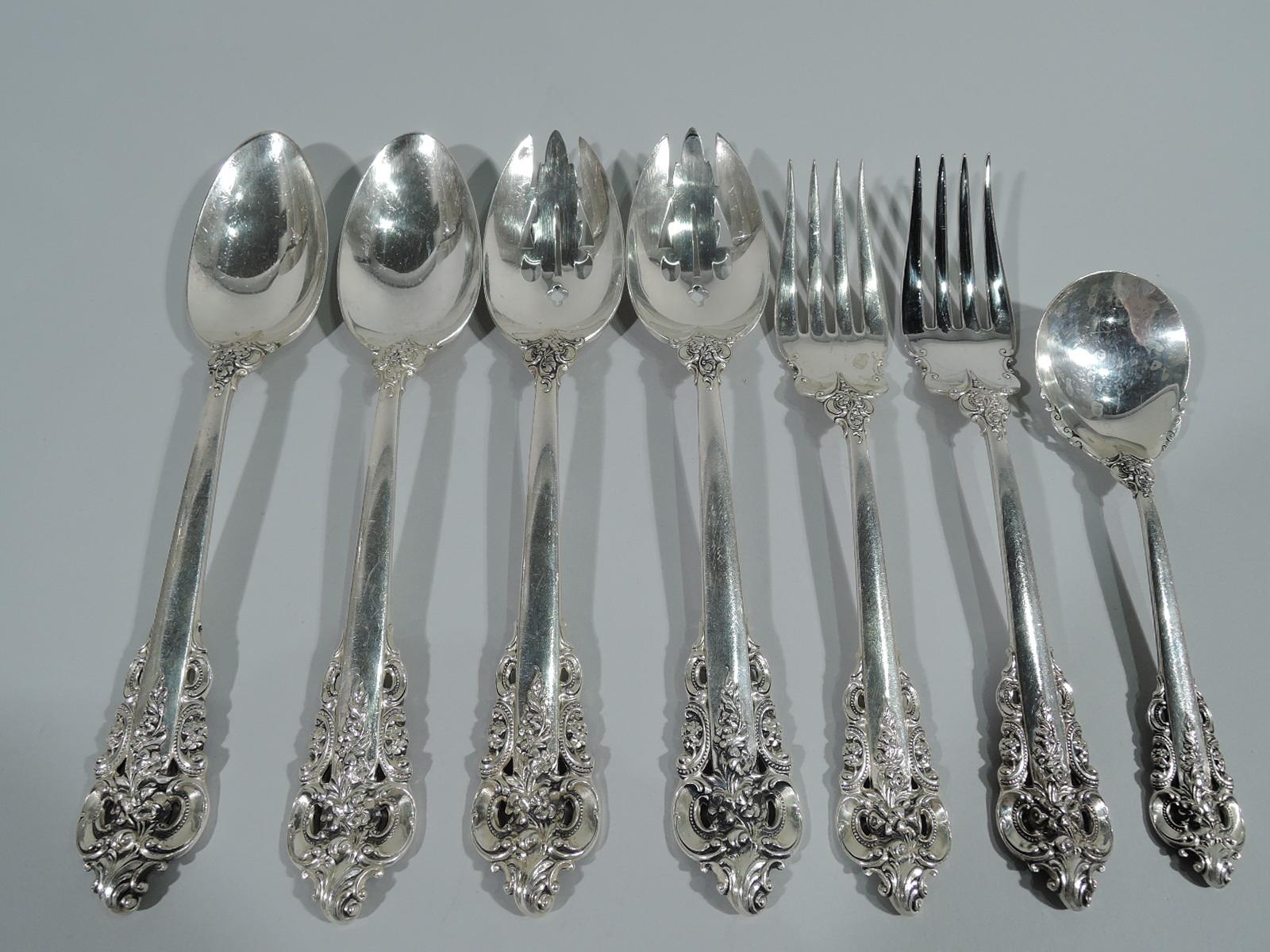 Sterling silver dinner set for 12 in Grande Baroque pattern. Made by Wallace in Wallingford, Conn.

This set comprises 96 pieces (dimensions in inches): Forks: 12 dinner forks (8), 13 salad forks (6 5/8), and 12 seafood forks (5 3/8); Spoons: 12