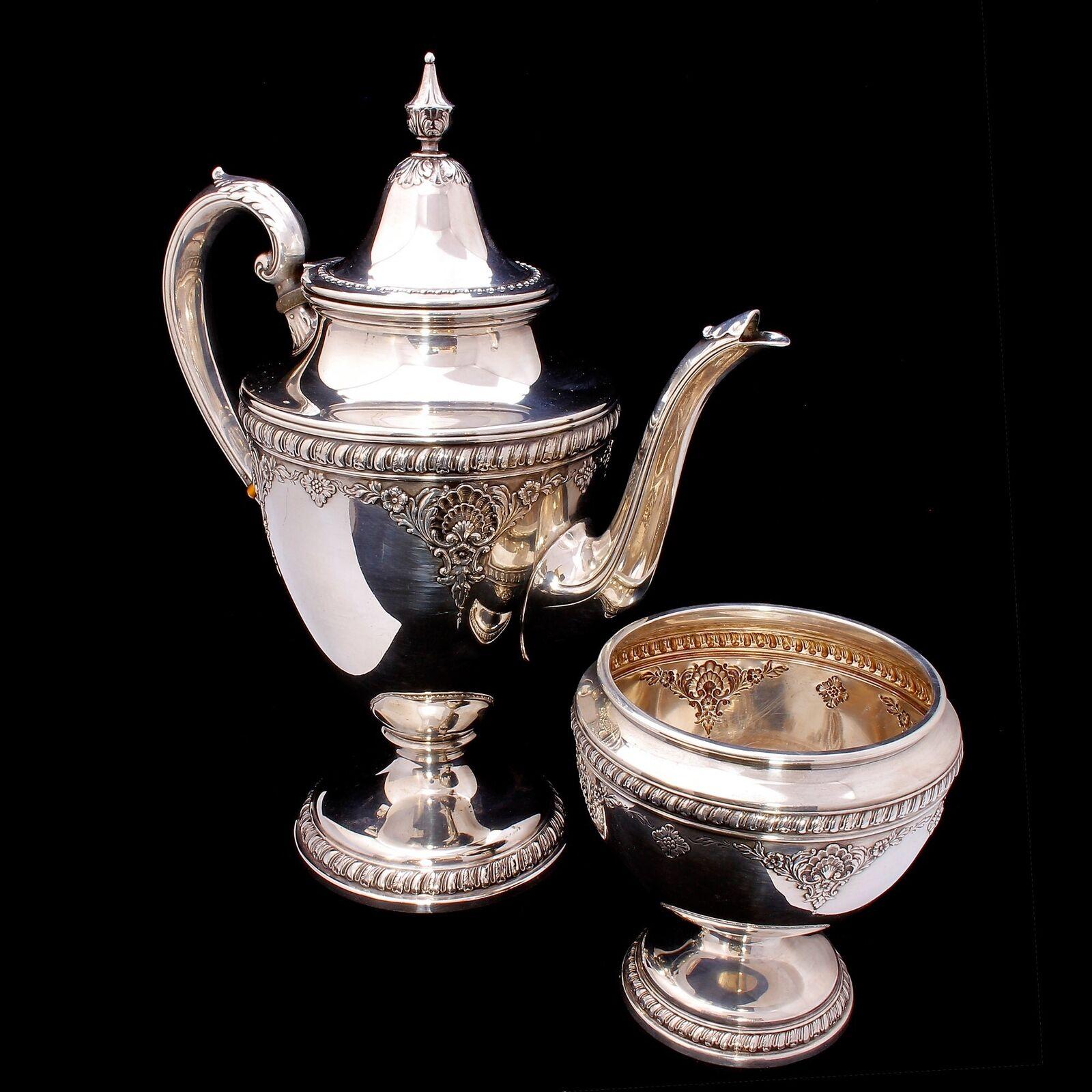 RARE Wallace Sir Christopher Sterling Silver 5 piece Coffee/Tea Set #4050

The rare and highly desirable Wallace Sir Christopher pattern sterling silver 5 piece coffee/tea set consisting of a coffee pot, tea pot, cream jug, sugar bowl with cover and