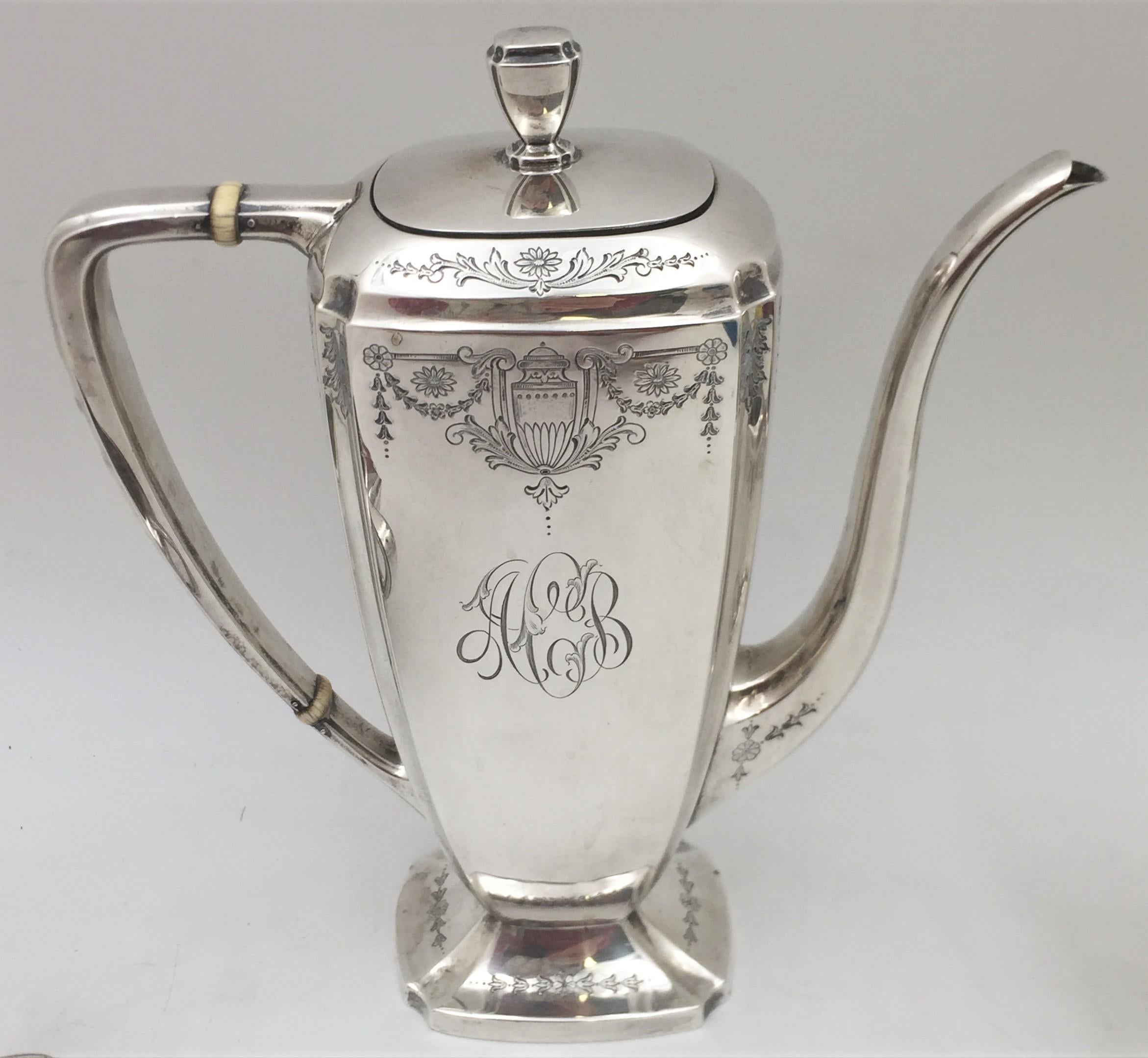 Wallace, sterling silver 3-piece coffee set, in pattern number 8479, with fine, detailed motifs of flower and urns consisting of:

- a coffee pot measuring 8 2/3