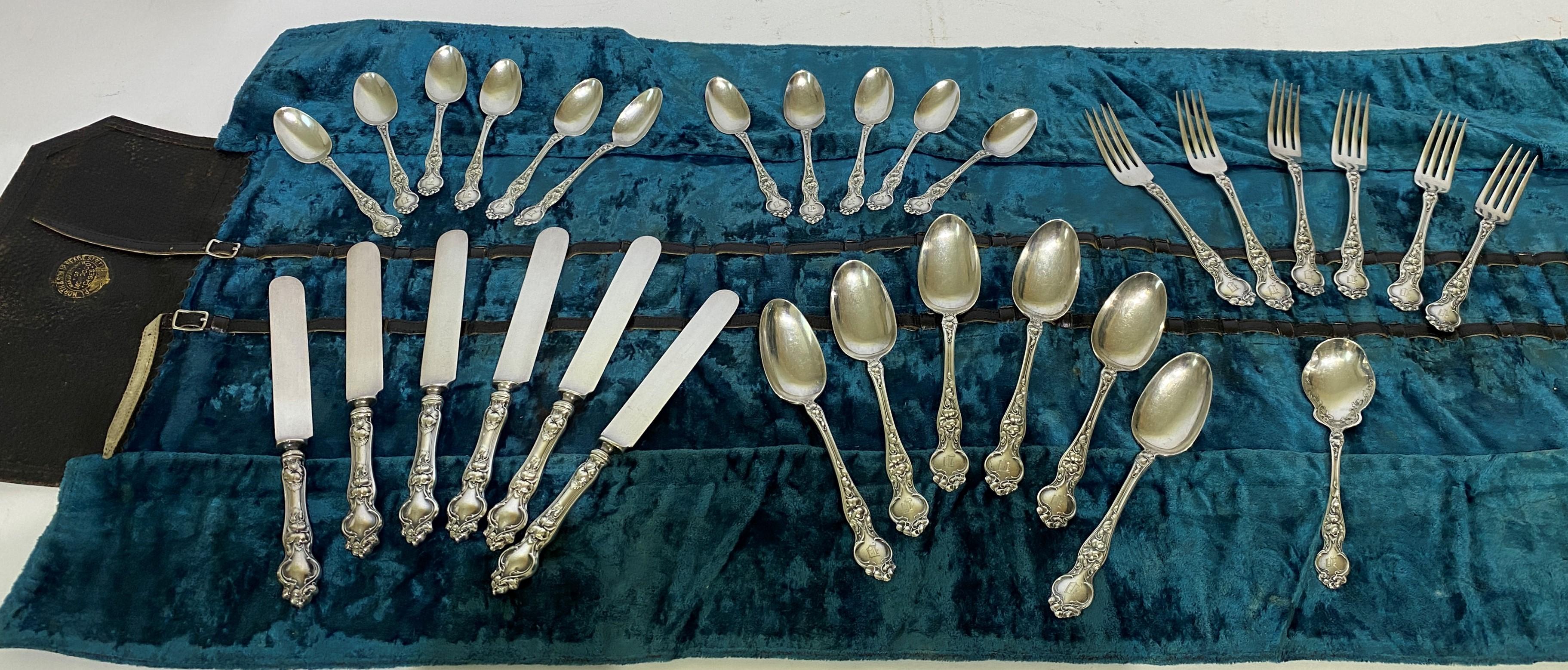 This stylish set of Wallace sterling silver flatware is in the circa 1904 