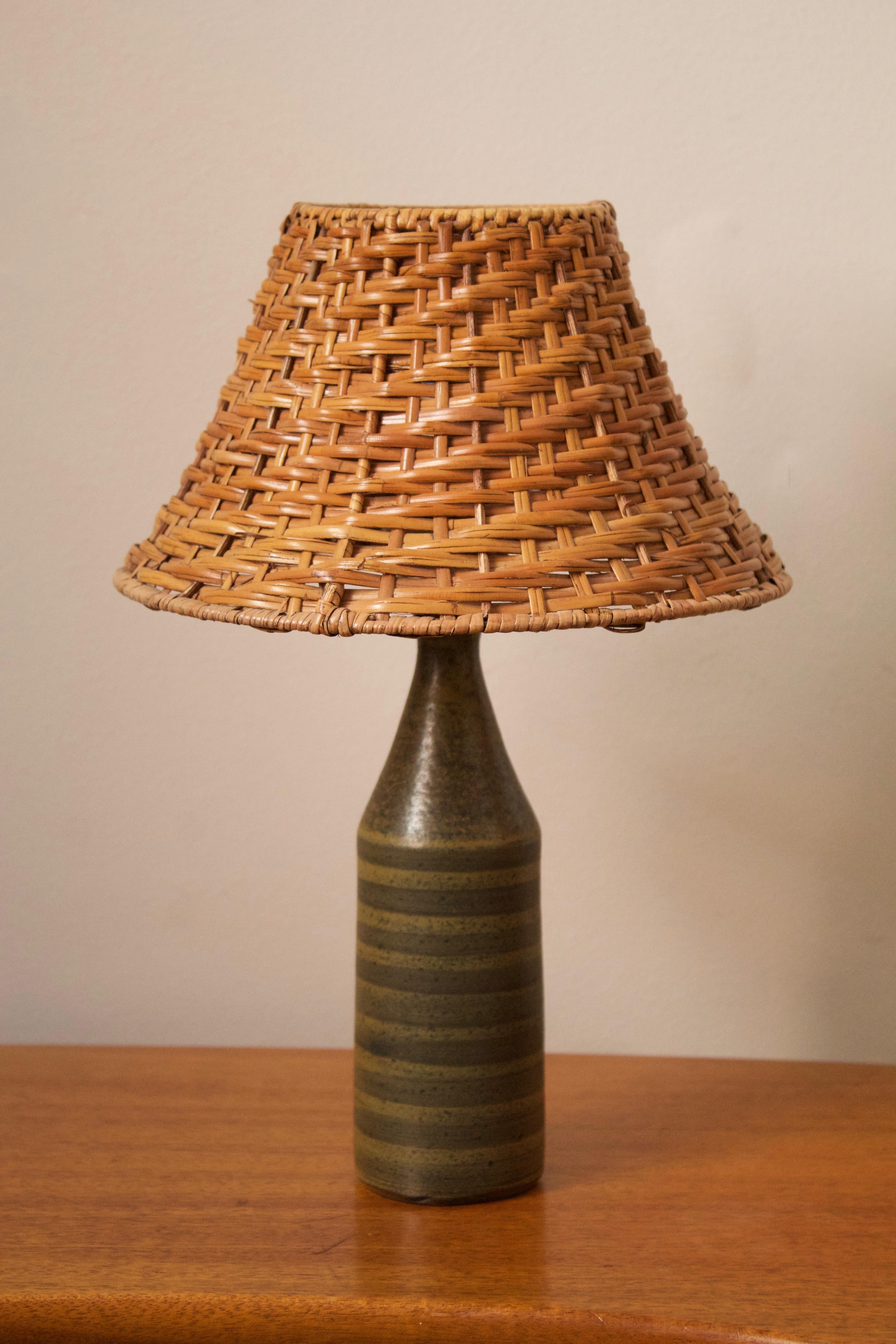 A table lamp. Designed and produced by Wallåkra, Sweden, 1960s. Features simple hand-painted and incised decoration.

Stated dimensions exclude lampshade. Height includes socket. Upon request illustrated lampshade can be included in purchase.