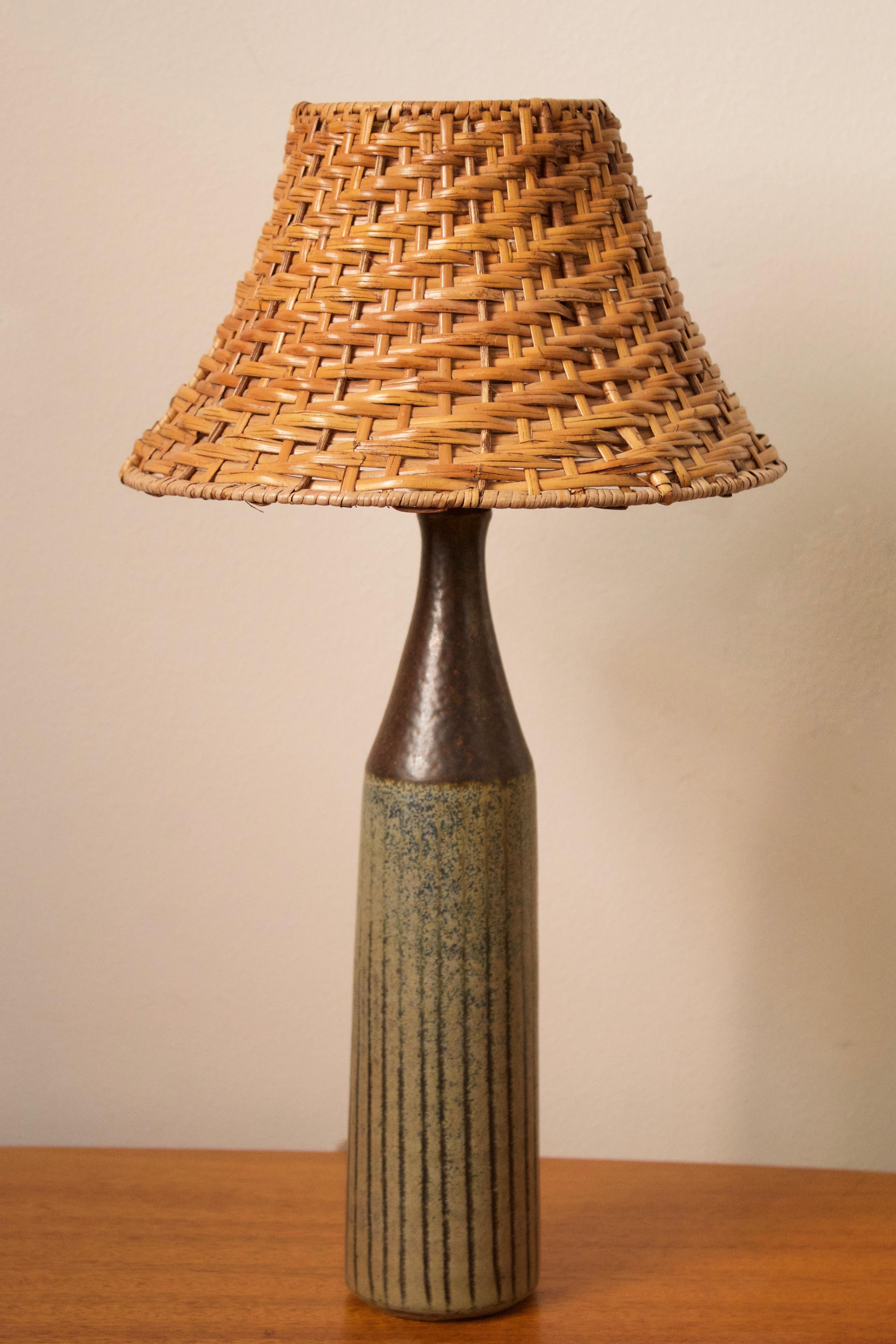 A table lamp. Designed and produced by Wallåkra, Sweden, 1960s. Features simple hand-painted and incised decoration.

Stated dimensions exclude lampshade. Height includes socket. Upon request illustrated lampshade can be included in purchase.