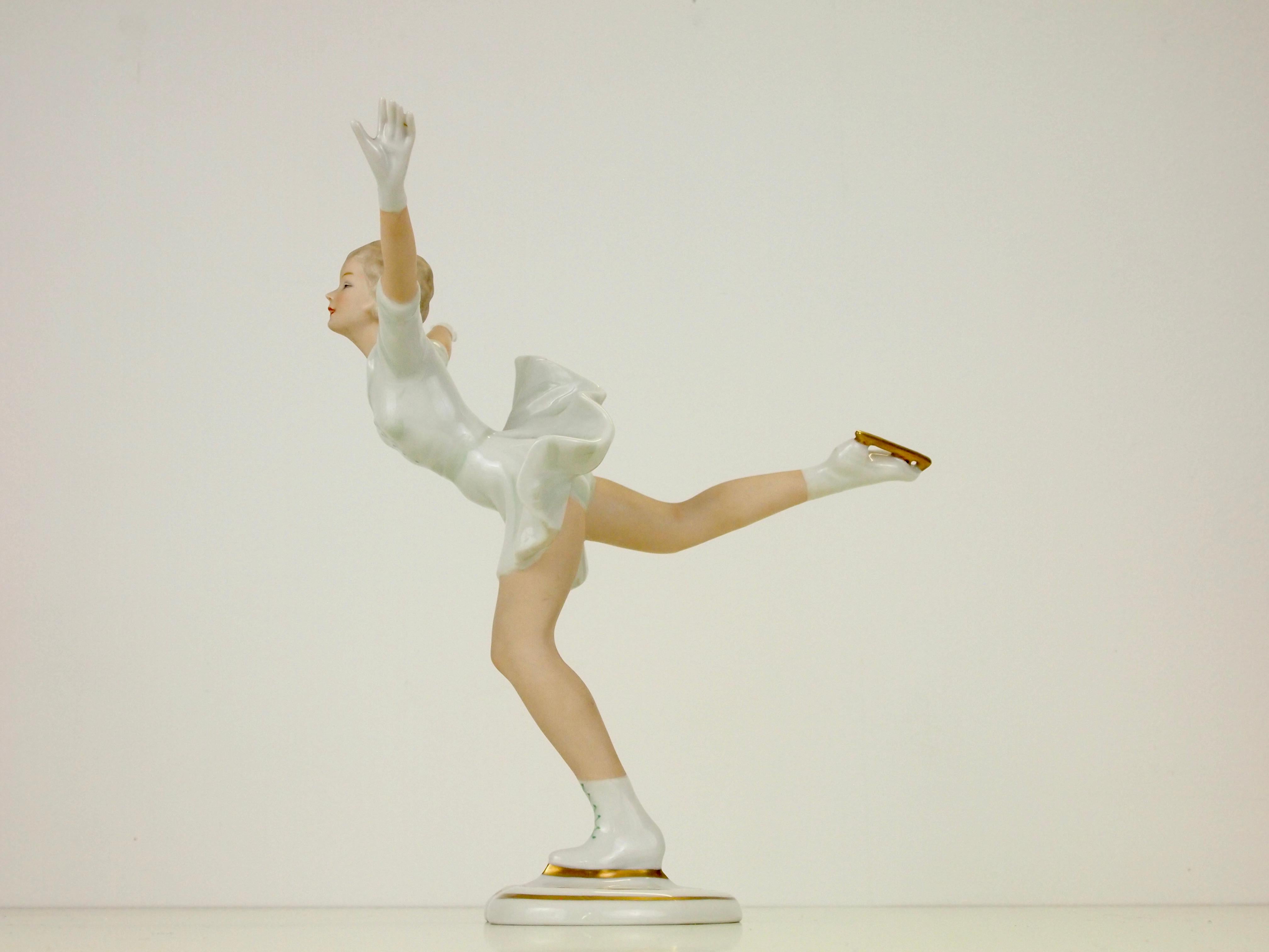 Very elegant hand painted porcelain figurine depicting a female figure skater from the former midcentury era.

This figurine is made in German of high quality porcelain with very fine hand painted soft tones and fine golden details.

The