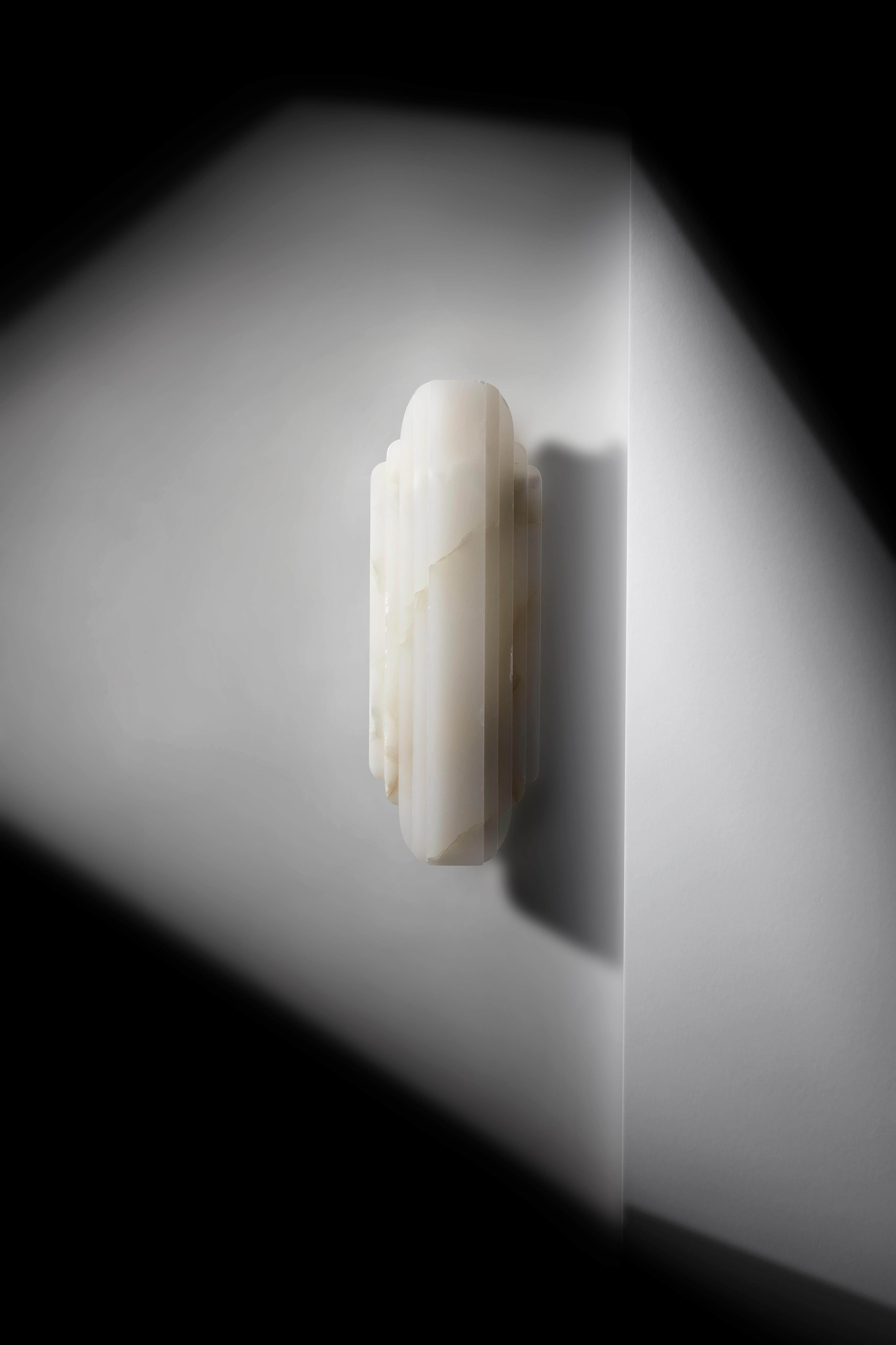 Walljewel White Onyx by Lisette Rützou
Dimensions: 15 x H 42 cm
Materials: Rose, Green and White Onyx

 Lisette Rützou’s design is motivated by an urge to articulate a story. Inspired by the beauty of materials, form and architecture, each