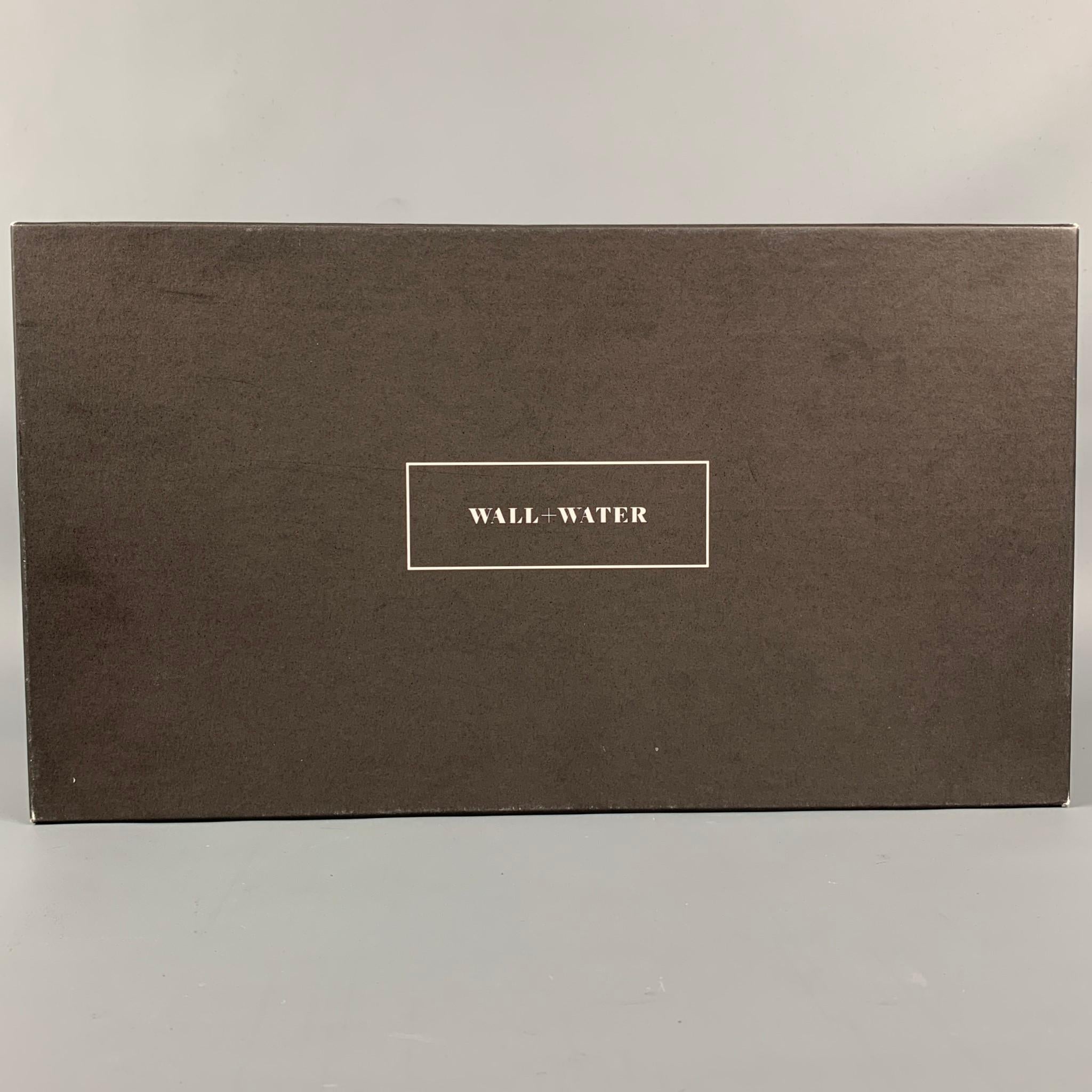 WALL+WATER loafers comes in a black leather featuring a round toe, tassel detail, and a stacked heel. Includes box. Made in Italy.

Very Good Pre-Owned Condition.
Marked: 7.5

Outsole: 11 in. x 3.5 in. 

SKU: 111447
Category: Loafers

More