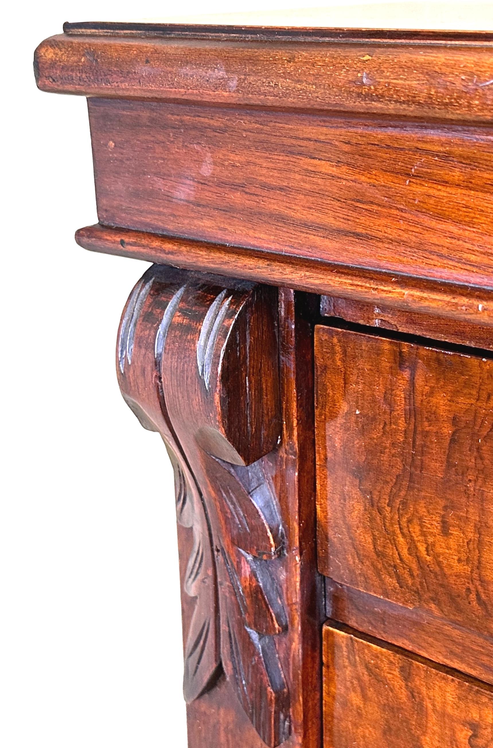 A Very Good Quality Late 19th Century, Victorian Period, Walnut Wellington Chest Of Drawers, Having Seven Superbly Figured Drawers With Original Brass Swan Neck Handles, Enclosed By Hinged Locking Pilaster With Carved Decoration, Raised On Original