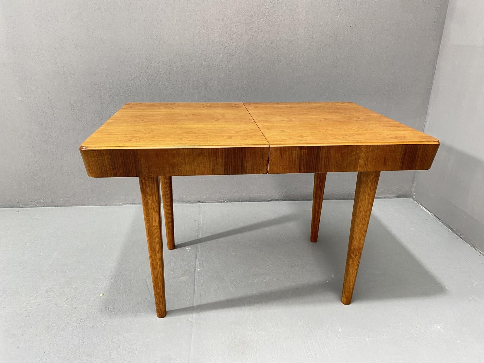 This adjustable dining table was designed and made by Setona company in the 1950s in the former Czechoslovakia. It´s made of walnut. The table can be easily unfolded and extended up to a length of 171 cm.

The table is in excellent condition, it was