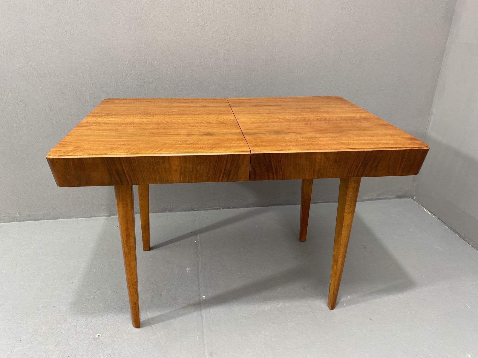 This adjustable dining table was designed and made by Setona company in the 1950s in the former Czechoslovakia. It´s made of walnut. The table can be easily unfolded and extended up to a length of 171 cm.

The table is in excellent condition, it was
