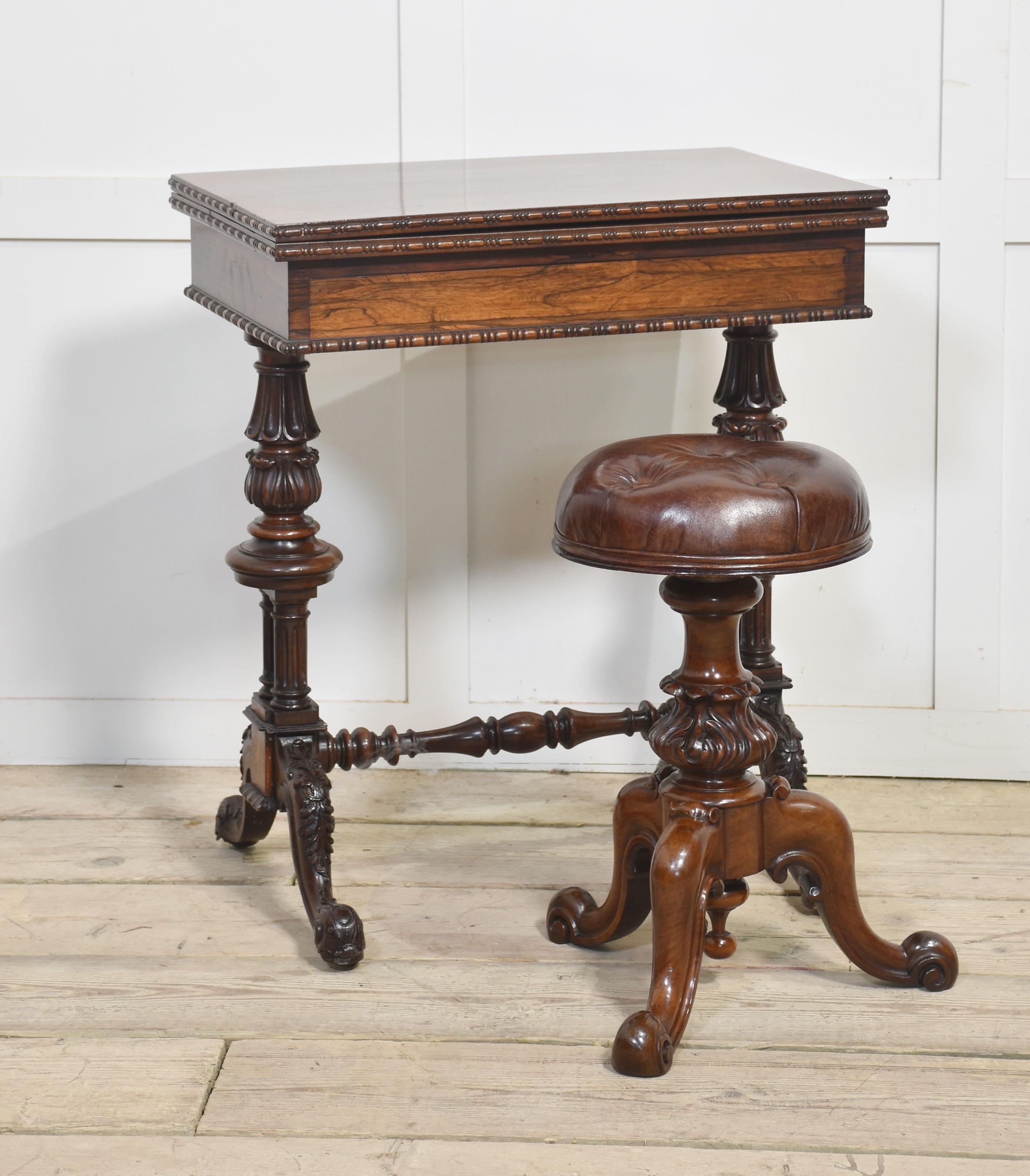 Walnut adjustable piano stool with leather upholstered seat above turned central carved column, all raised up on scroll cabriole legs.
Dimensions
Height 21 Inches adjustable to 25.5 Inches
Width 16.5 Inches
Depth 16.5 Inches