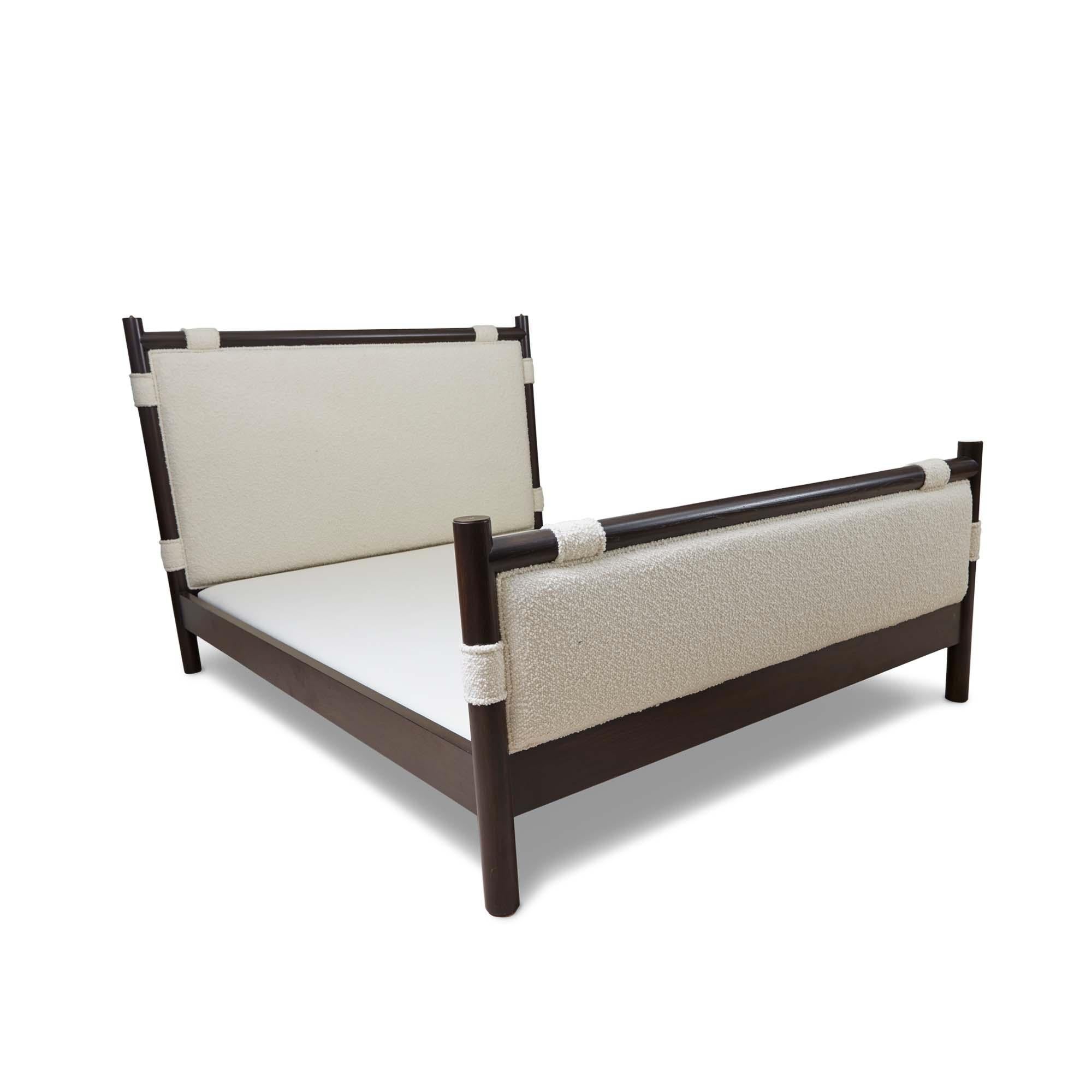 The Chiselhurst bed is an upholstered bed with a solid American Walnut or White Oak frame finished with brass caps. Slats are provided. Available with or without footboard. Shown here in Dark Walnut and Alpaca Bouclé. 

The Lawson-Fenning