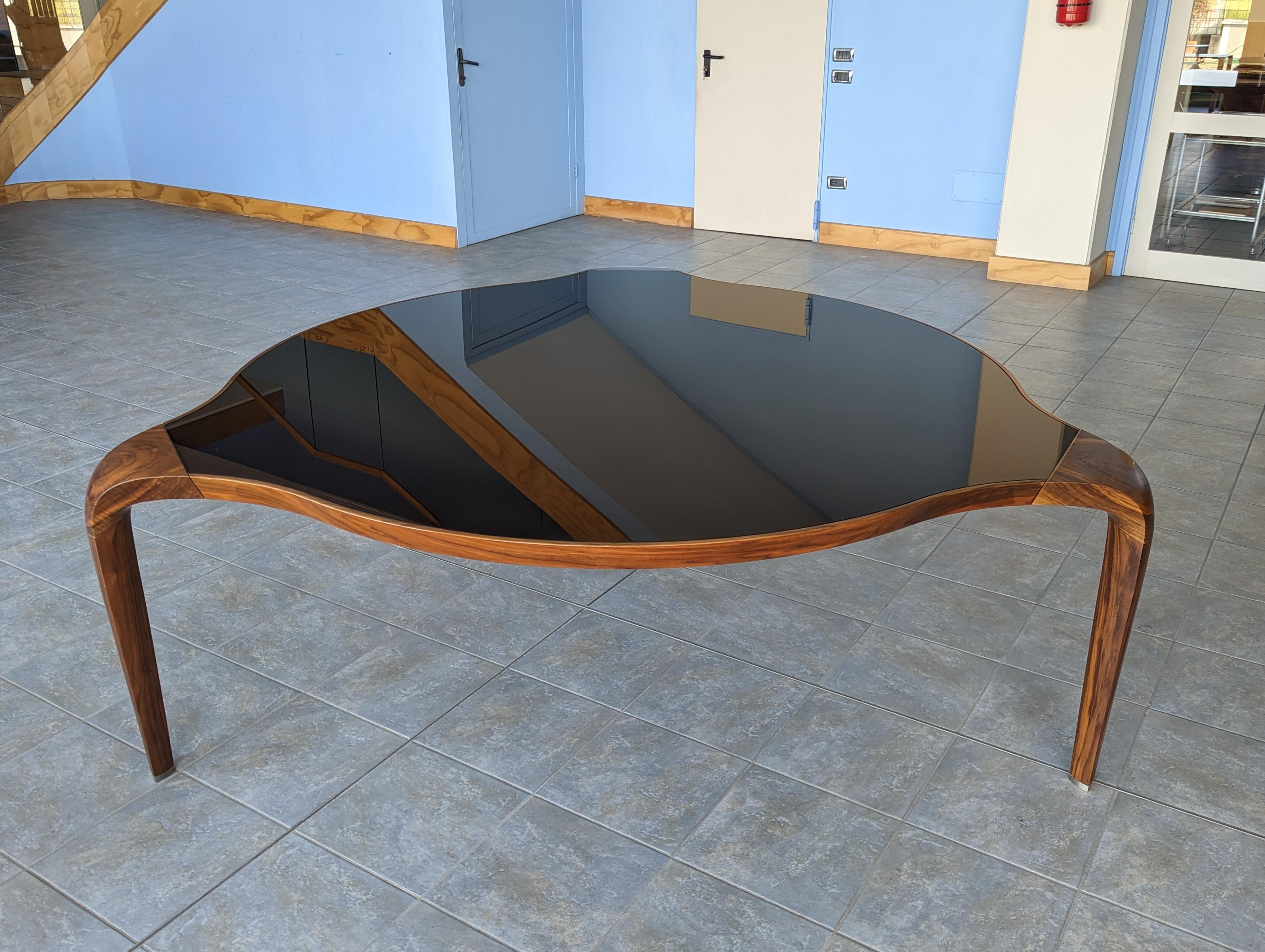 Mid-Century Modern Walnut and Black Glass Round “ Erasmo”Table of Italian Manufacture, by Giorgetti For Sale