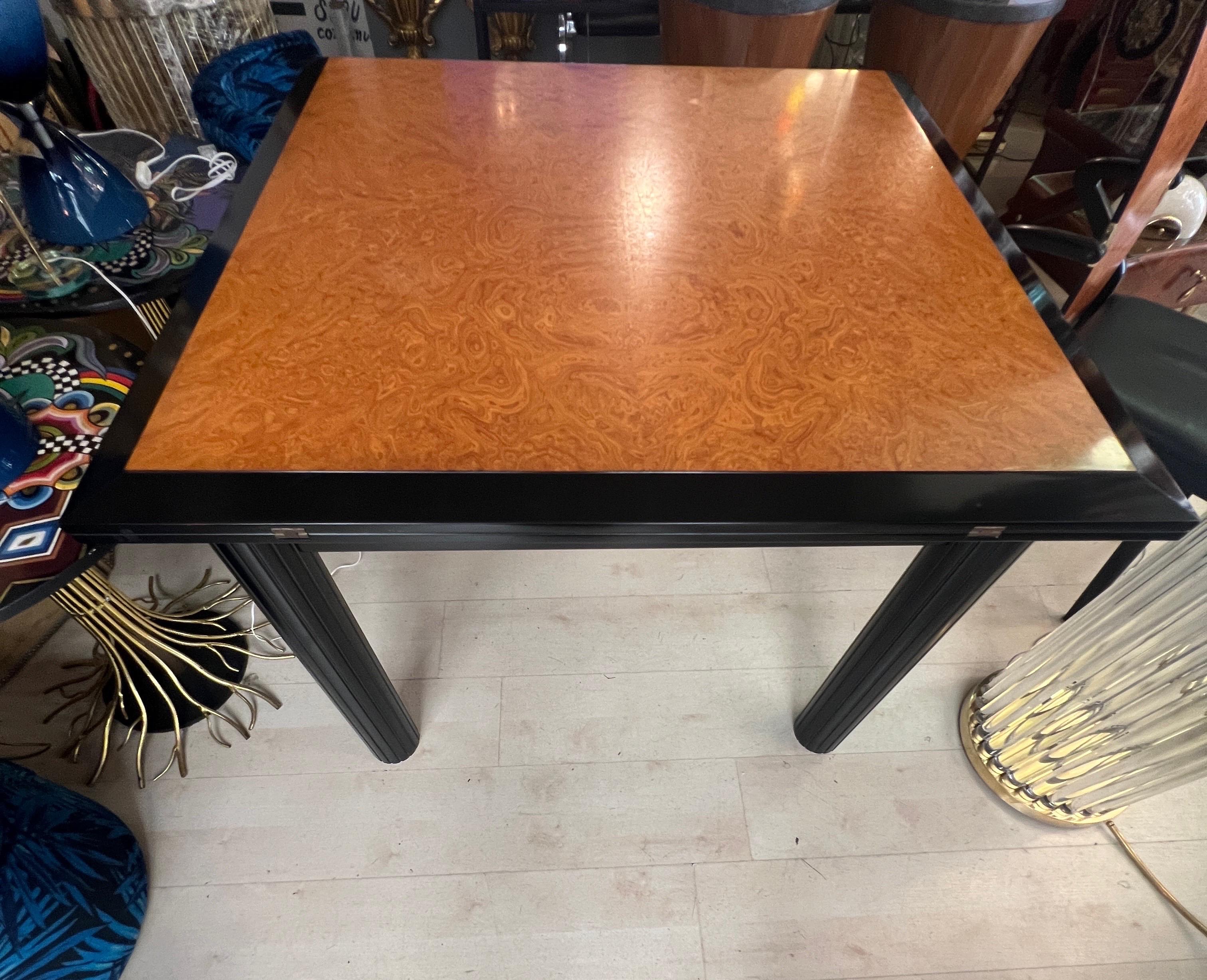 Walnut and Black Laquered Extendable Dining Table with Folding Opening. 
The Dining Table is extendable with Folding Opening, when it is opened is in total black lacquered wood and the measurements are cm 210x105.
