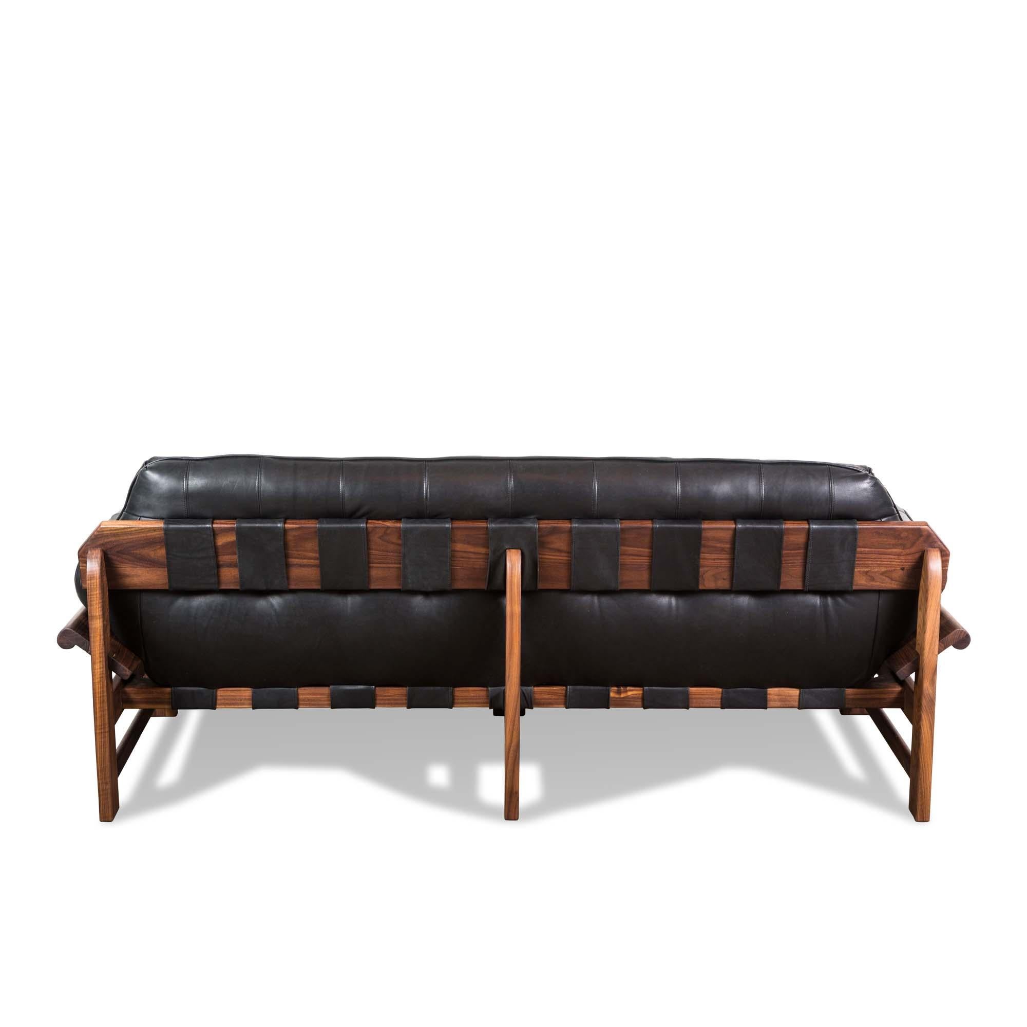 The Ojai sofa features a solid white oak or solid walnut base and a single tufted leather cushion with leather straps. 

The Lawson-Fenning Collection is designed and handmade in Los Angeles, California. Reach out to discover what options are