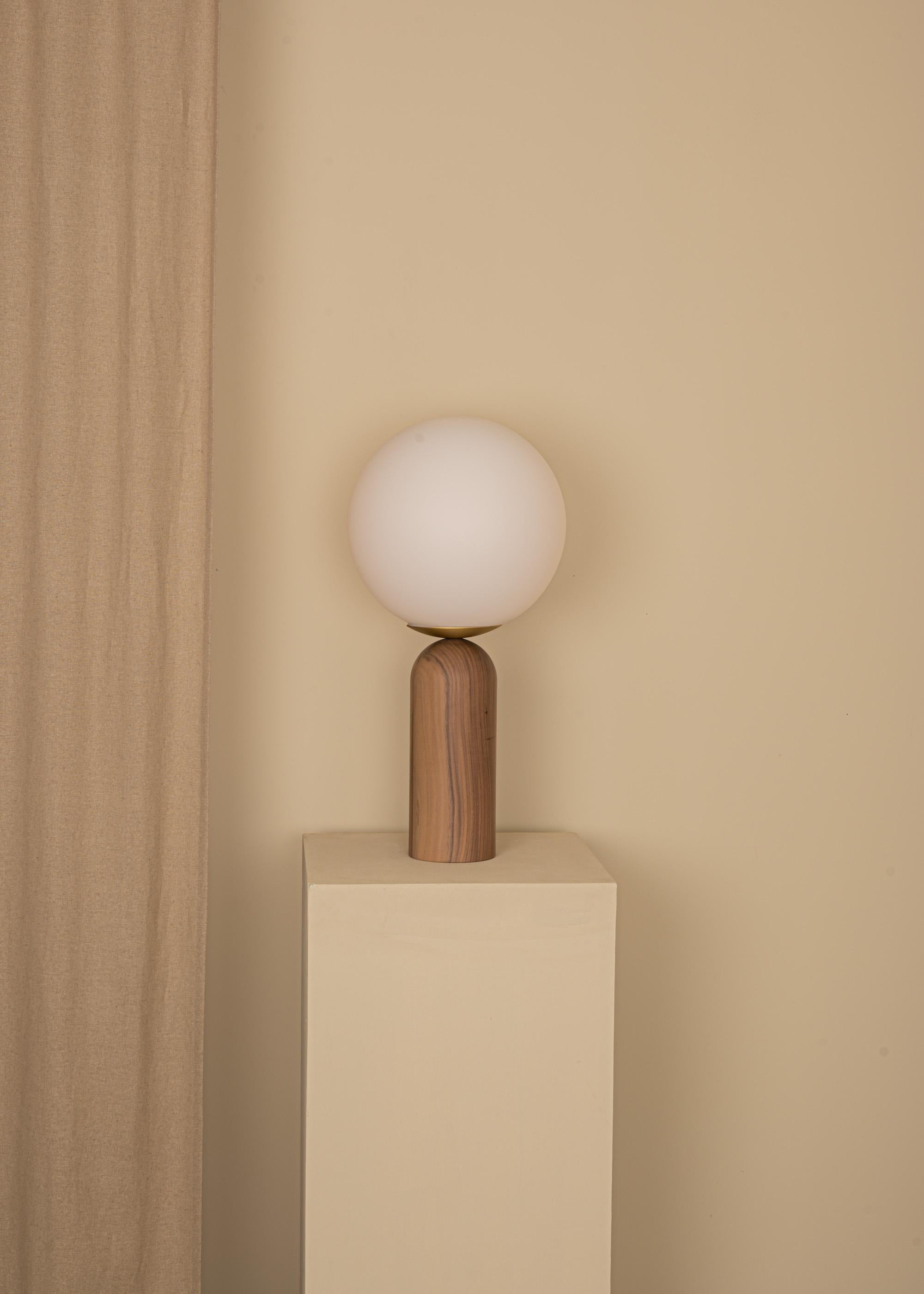 Walnut and Brass Atlas Table Lamp by Simone & Marcel
Dimensions: Ø 30 x H 60 cm.
Materials: Glass, brass and walnut.

Also available in different marble, wood and alabaster options and finishes. Custom options available on request. Please contact