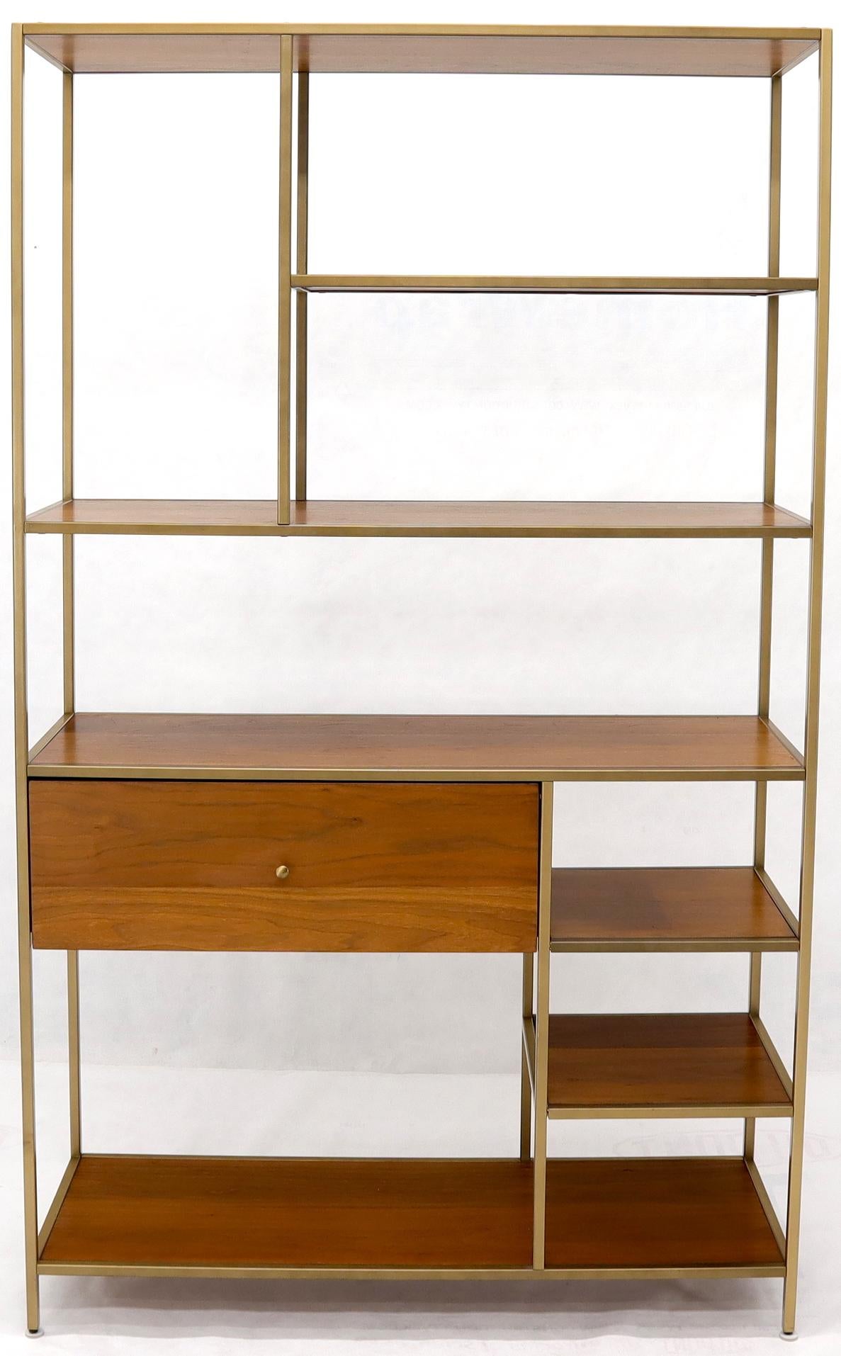 brass and wood shelving unit