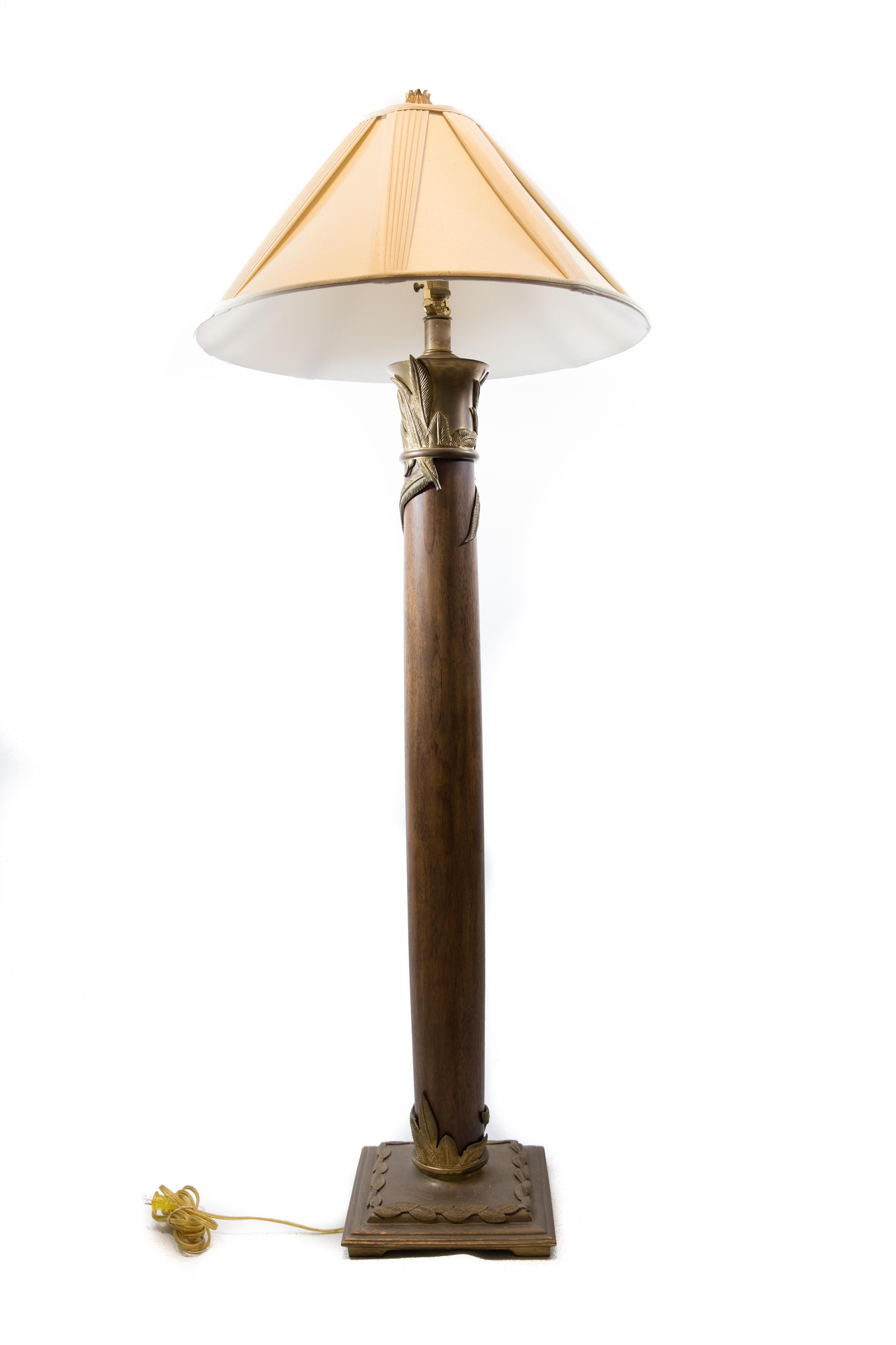 I would love to know who designed and made this exceptional moderne midcentury floor lamp. The lamp pays homage to ancient architectural forms for columns. The top and base of the column are entwined with bronze floral motifs for a unique statement.