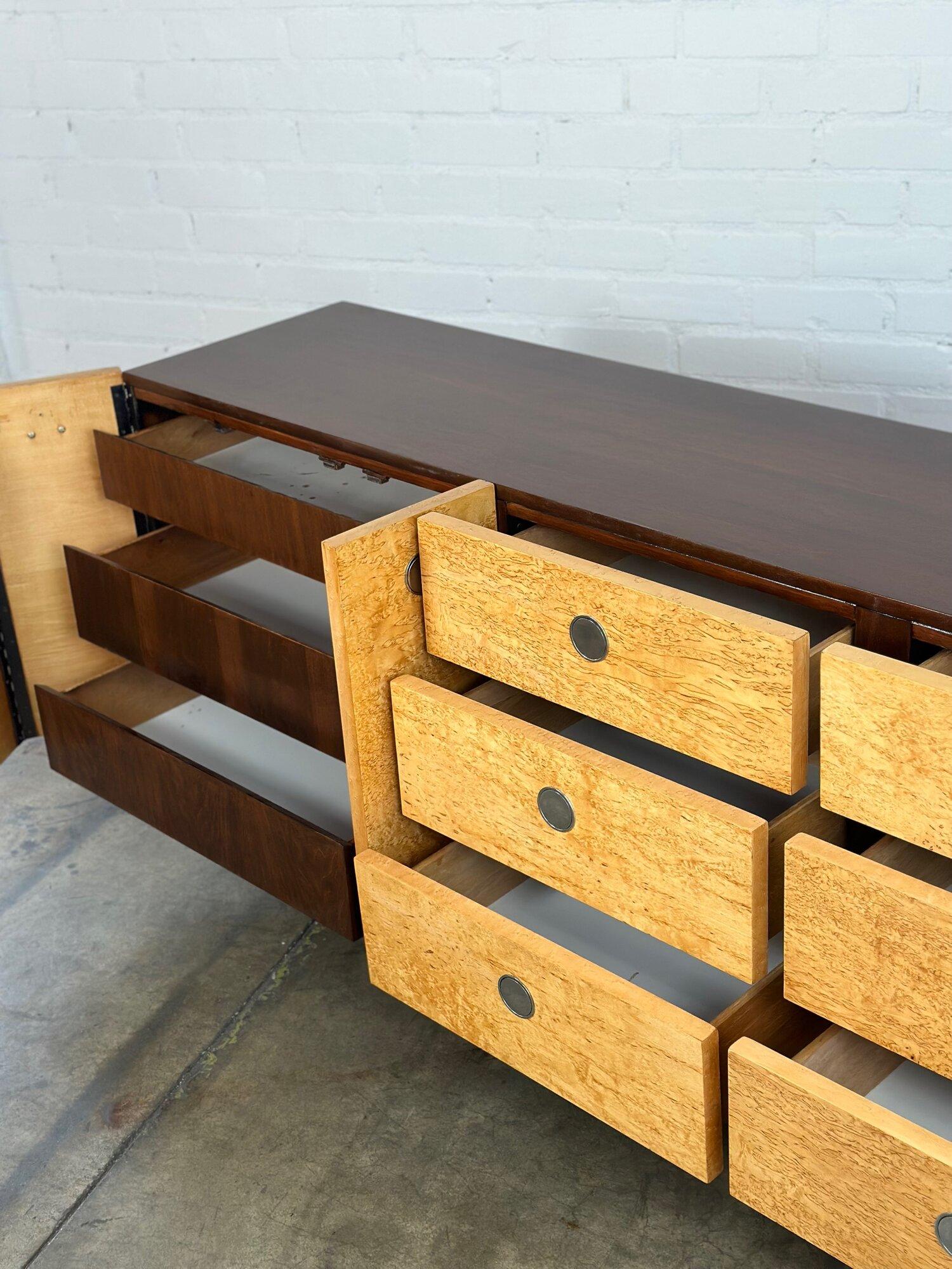 Measures : W76 D19 H31

Midcentury burl wood dresser with chrome hidden pulls. Dresser has a walnut finish frame and opens to reveal more storage. Item is structurally sound and sturdy. Item has no major areas of wear, matching nightstands are