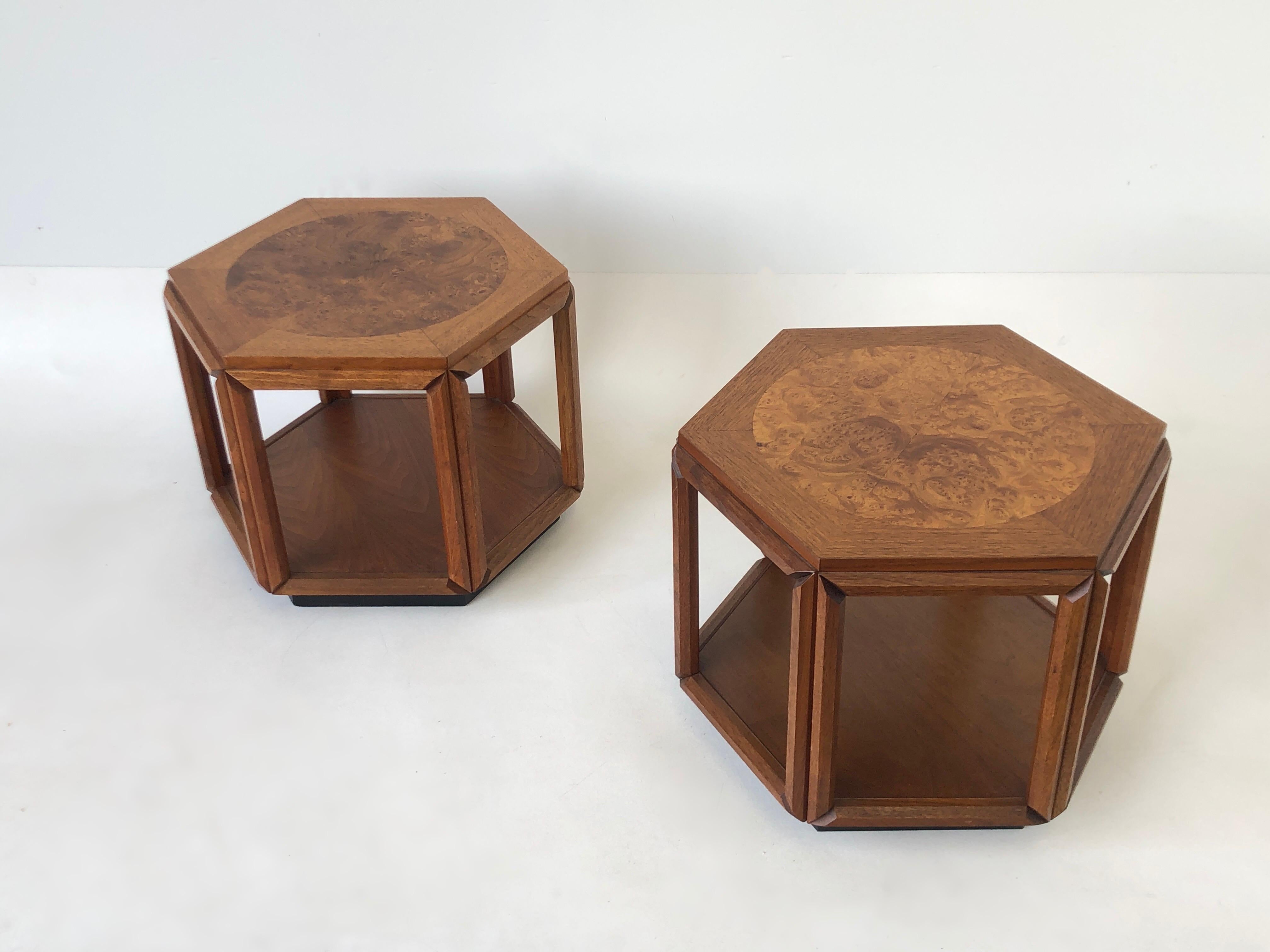 Pair of hexagonal shape side tables design by John Keal for Brown Saltman in the 1970’s.
Constructed of walnut with a burl wood circle on the top. 
In beautiful vintage condition with minor wear consistent with age.
Measurements: 15.38” high