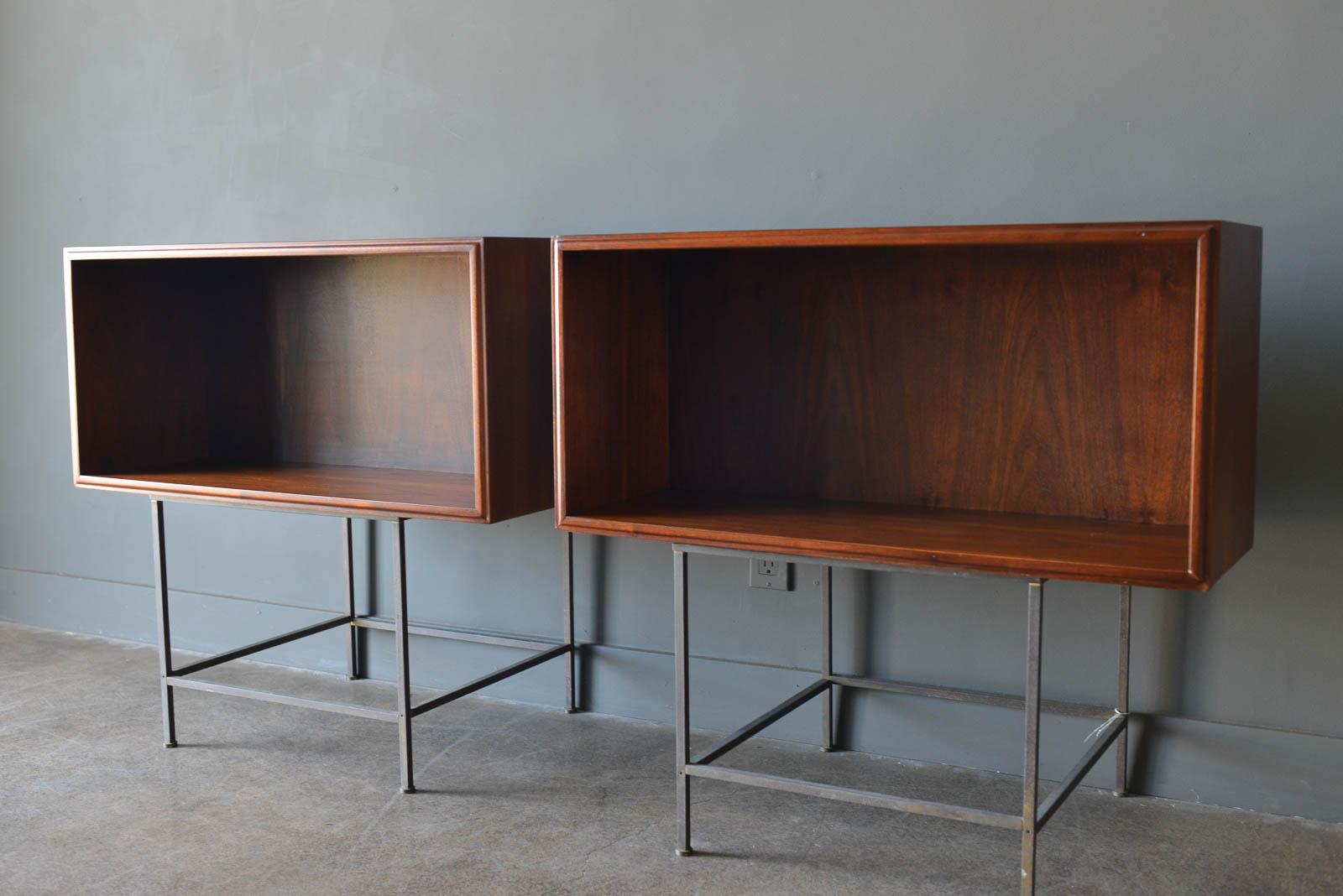 Walnut floating cabinets or nightstands, ca. 1955. Gorgeous pair of walnut floating cabinets or side tables/nightstands. These beautiful pieces have a custom bespoke made bracket that will allow you to float on the wall either together or apart.