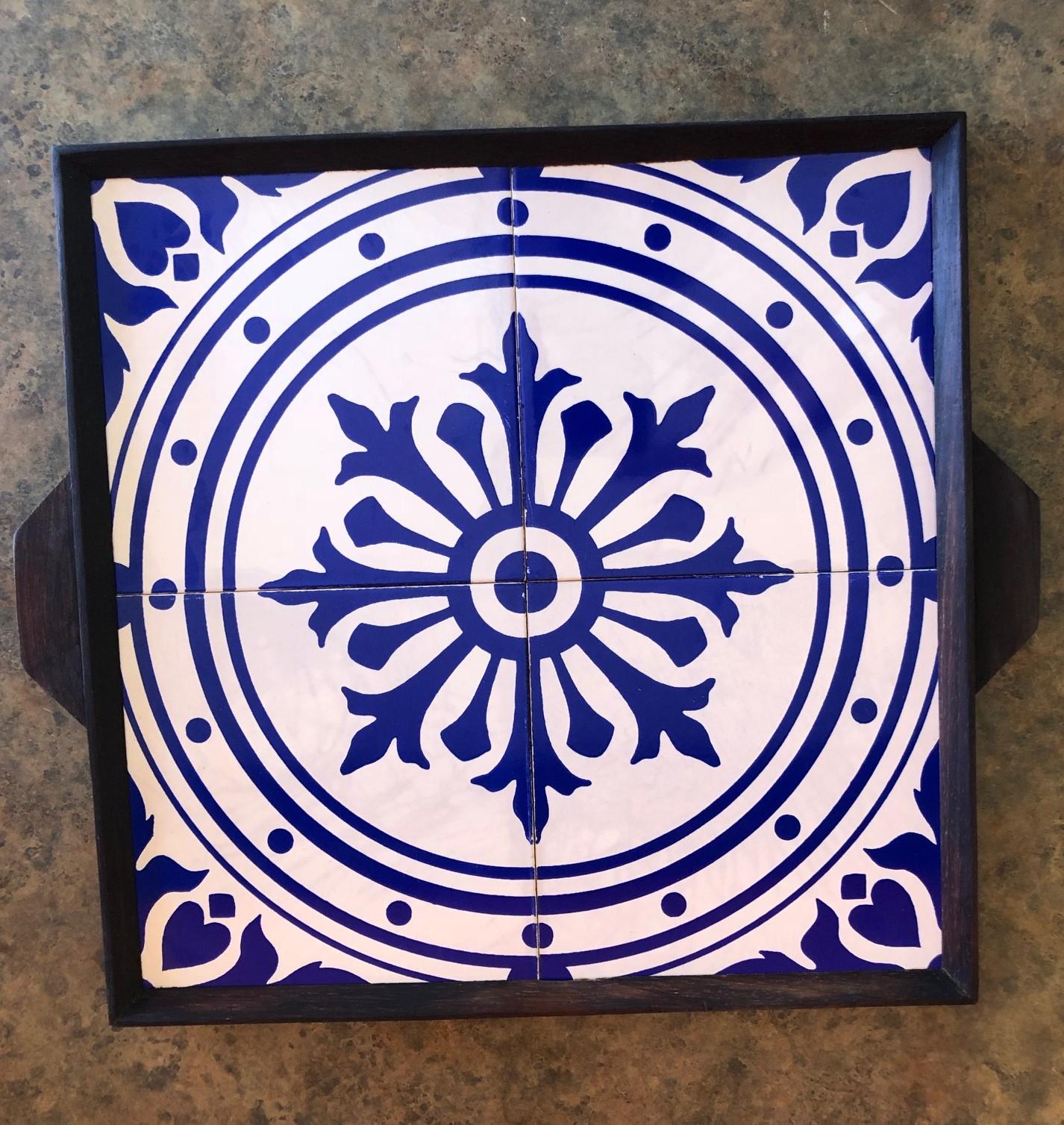 A very bright and colorful midcentury tray made of walnut and blue or white ceramic tiles believed to be from Scandinavia, circa 1960s. The measures 14.5