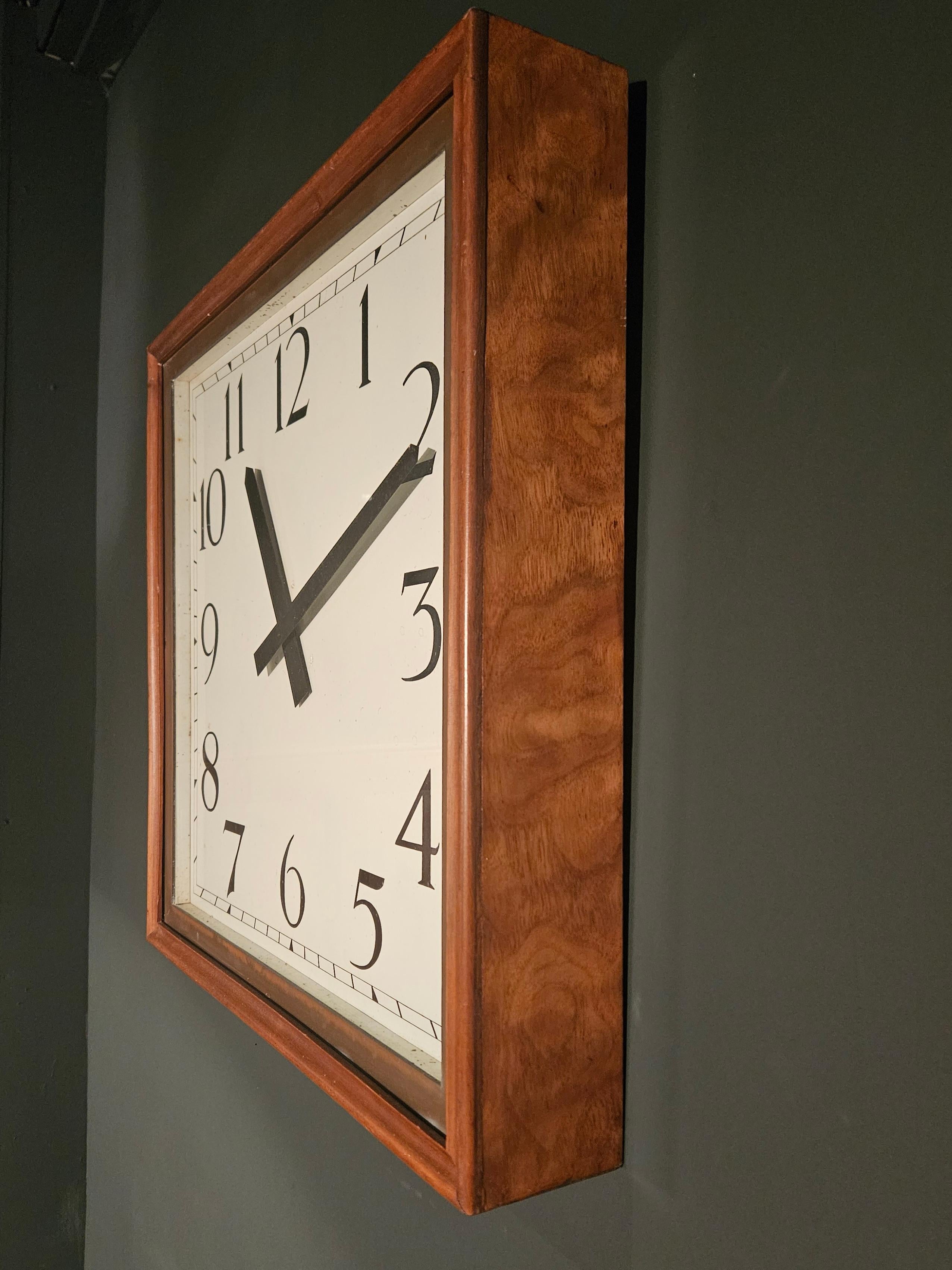 Walnut and Copper Wall Clock C.1920.  The clock is in practically mint original condition, has been fully serviced and tested and is in perfect working condition.  The clock runs on mains electric.

Alternatively can be converted to run on battery,