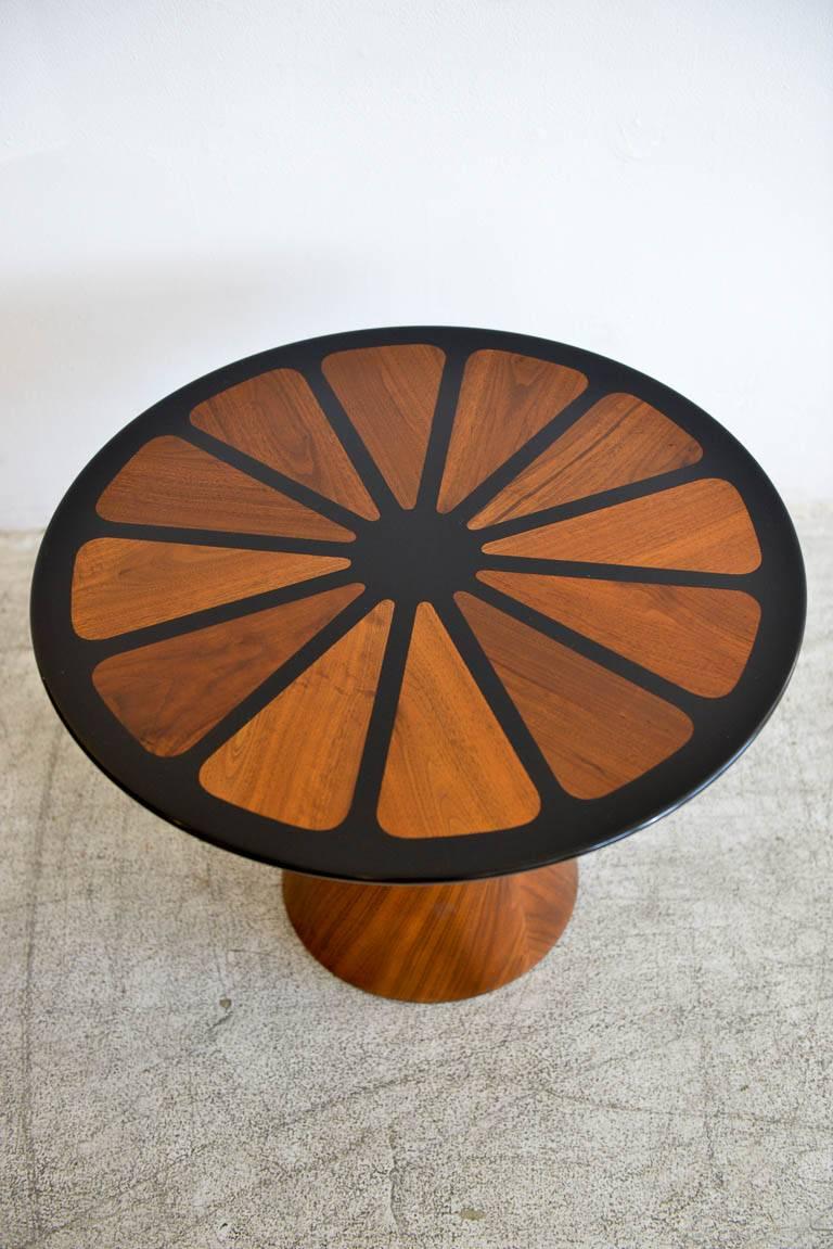 Walnut and enameled side table with petal motif top by Frank Rohloff, circa 1969. Rare petal top design, top is removable and fits snugly on the metal enameled base. Very few of this design were made by Mr. Rohloff for the Brown Saltman Company of