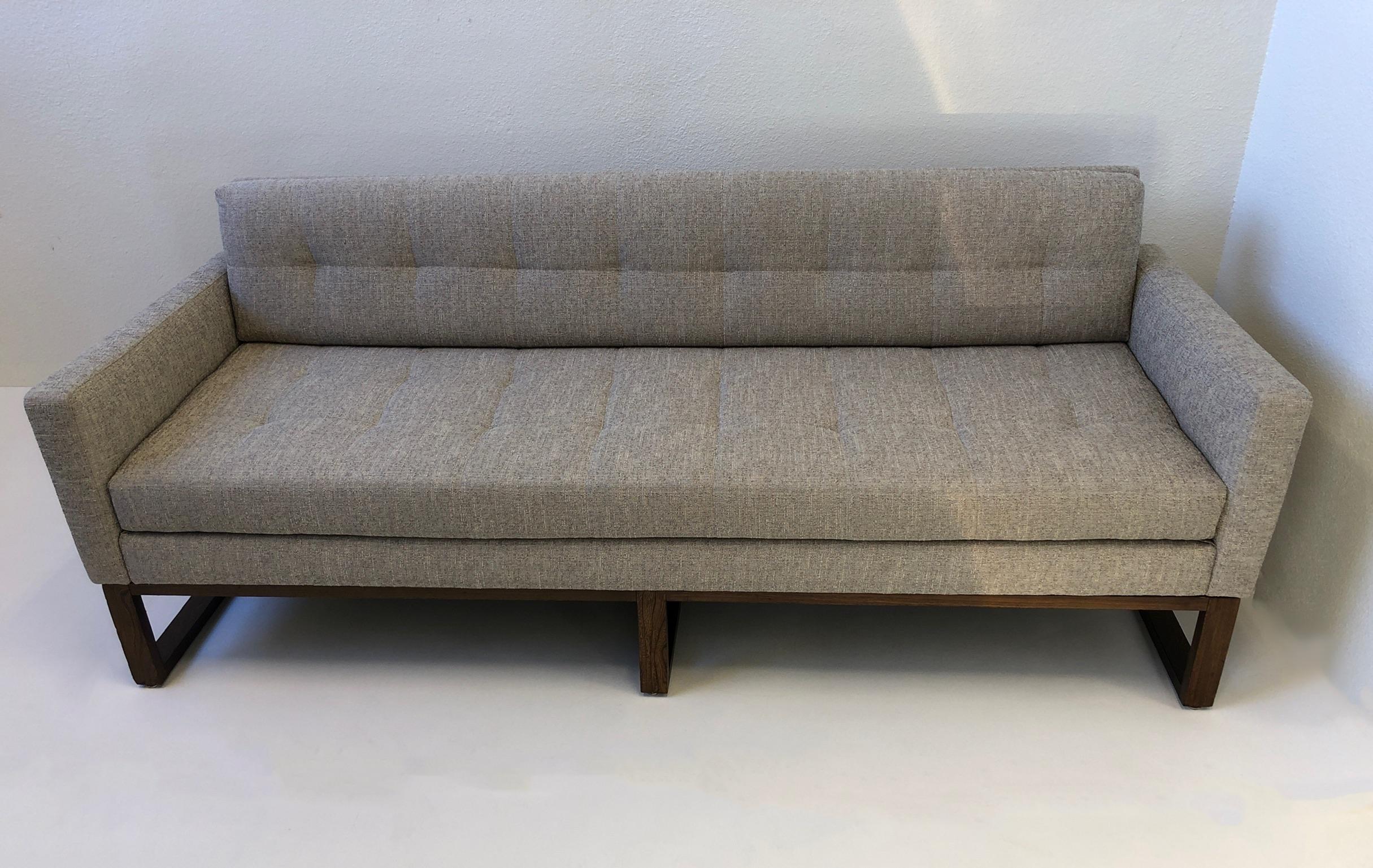 A beautiful 1970s sofa with a walnut leg frame. The sofa has been newly recovered, the frame is in original condition and it has minor chips on the back legs (see detail photos).
Measurements: 79” wide 30” deep 18” seat 23.5” arm 30” back.