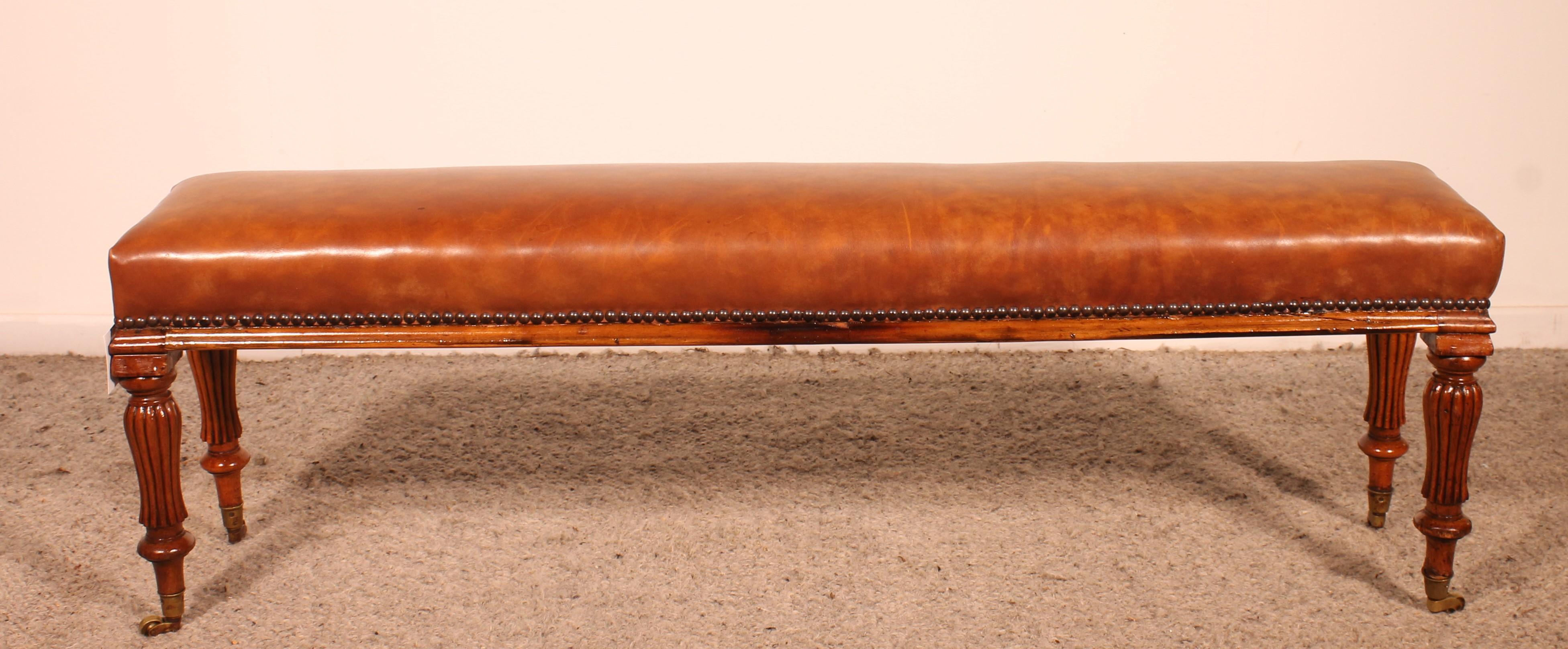 19th Century walnut and leather bench from the 19 century For Sale