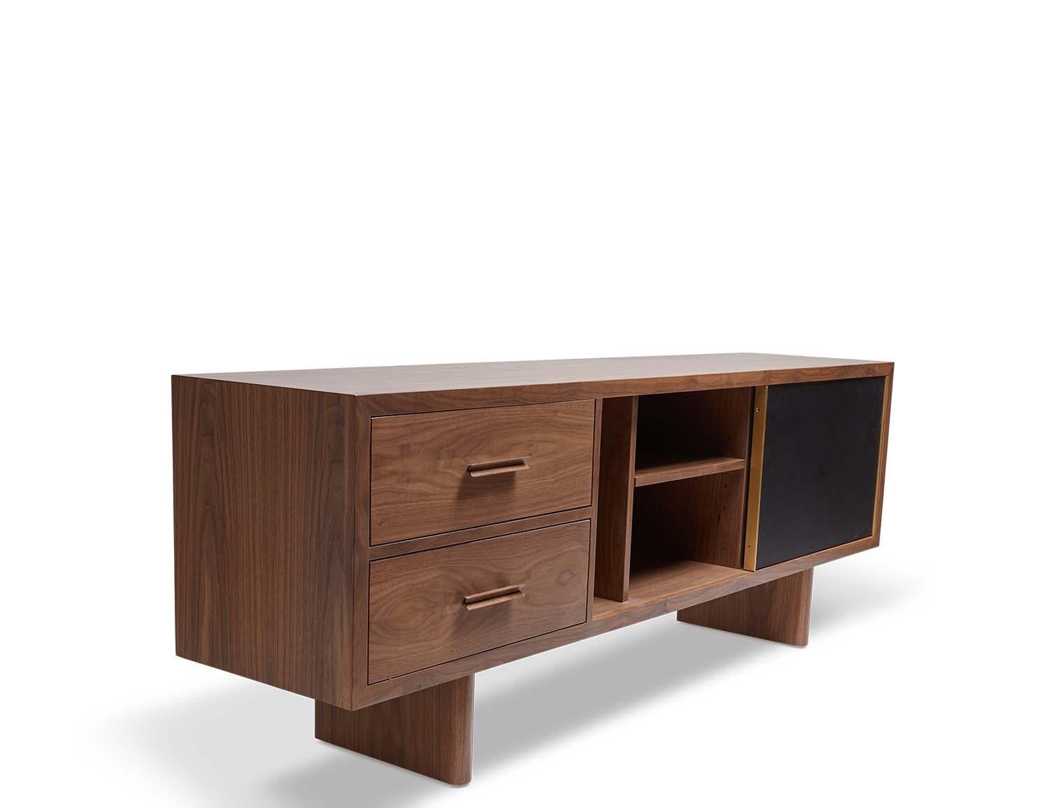 The inverness media cabinet features two drawers with solid carved handles, adjustable shelves, grommet holes and a sliding leather door with a solid brass handle. Available in American walnut or white oak. Wall-mounted version available. Specify at