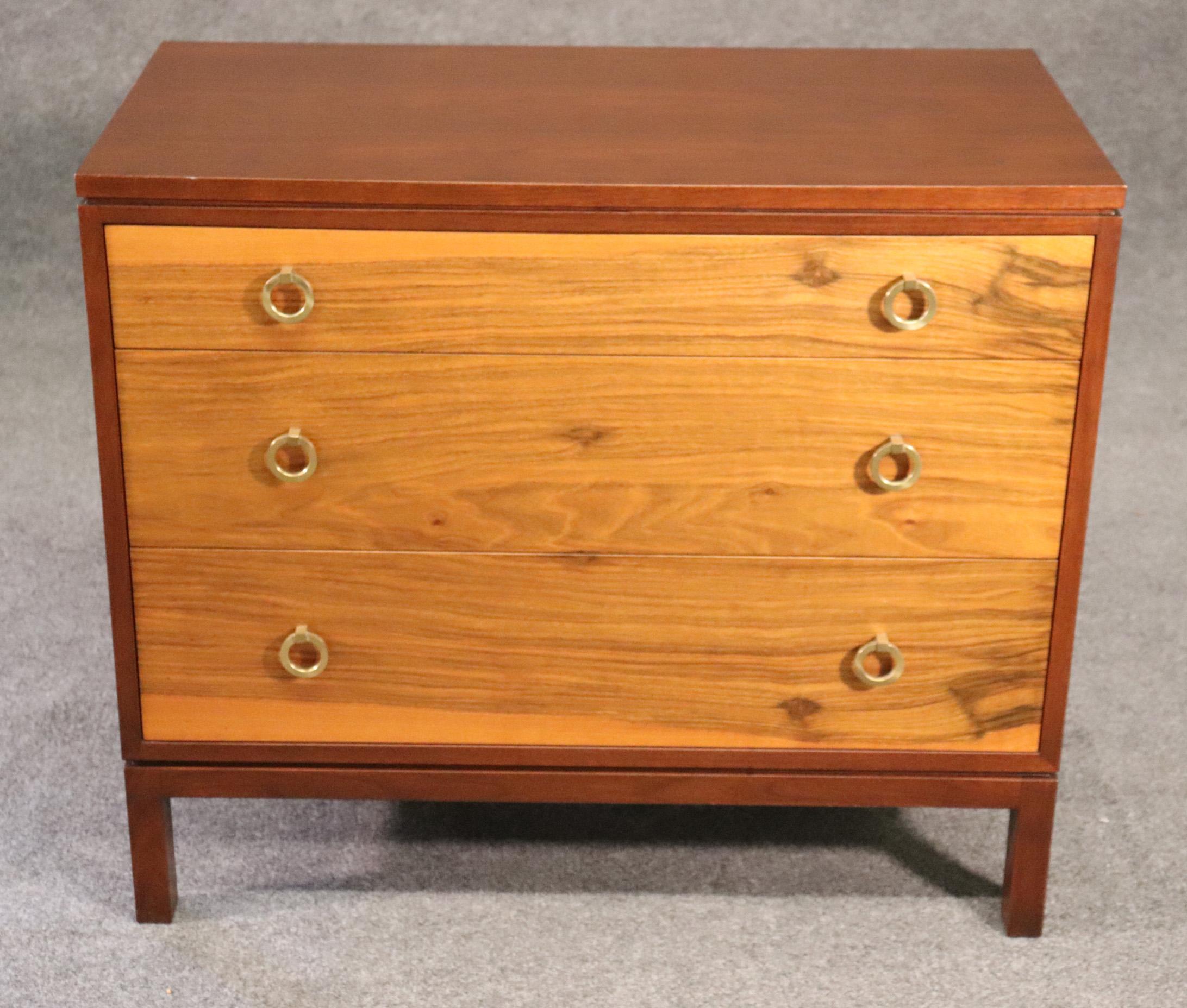 Dunbar has always been know for some of the finest furnture ever made in the United States. The commode is made of both solid walnut and solid mahogany and is in good used condition with minor signs of age and use. There are some minor scuffs and