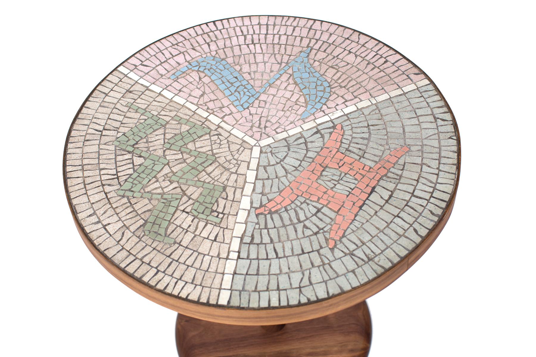 Mosaic tile and walnut side table, circa mid-1960s.
This custom example has an intricate and stunning mosaic top and solid walnut base.